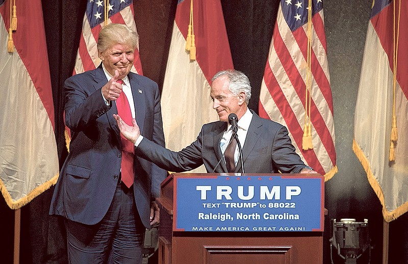 Sen. Bob Corker, R-Tenn., gets a thumbs-up from Donald Trump at the presumptive Republican nominee's campaign event in Raleigh, N.C., Tuesday. Corker's appearance was the first by anyone on Trump's reported short list of running mates since he began vetting them in a series of meetings.
