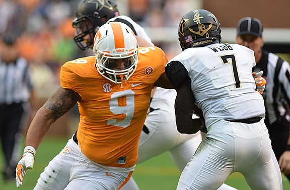 Tennessee's Derek Barnett (9) wraps up Vanderbilt's Ralph Webb (7).  The Vanderbilt Commodores visited the Tennessee Volunteers in SEC football action November 28, 2015.