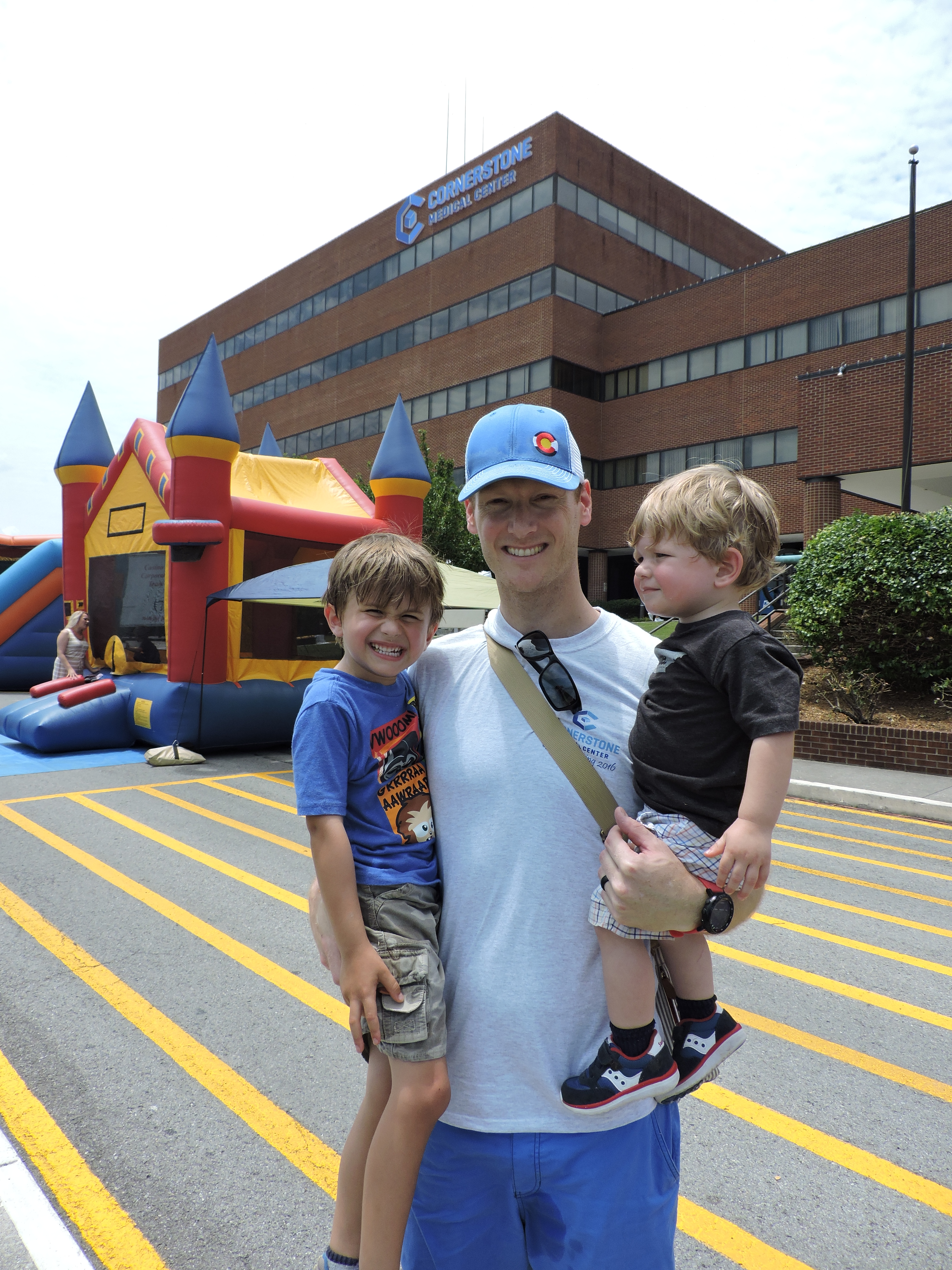 Charles Owenby, 4, Cornerstone Medical Center Emergency Room Medical Director Dr. Paul Owensby and Harrison Owensby, 1, from left, take part in the Family Fun Day. 