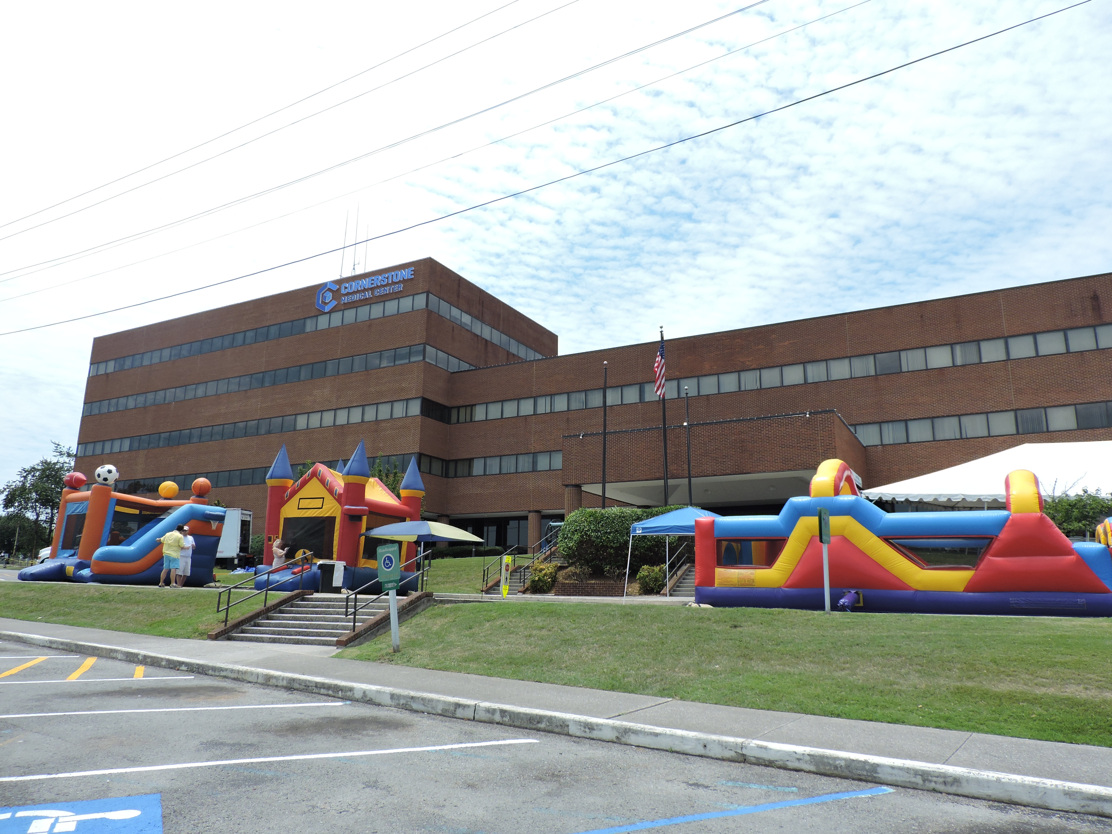 Cornerstone Medical Center Family Fun Day welcomes children to bounce on the inflatables while their parents mingle.