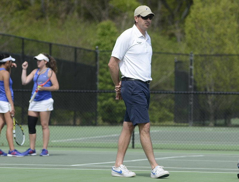 UTC women's tennis coach Jeff Clark watches play in 2014 at the Champions Club during the Southern Conference tennis tournament.