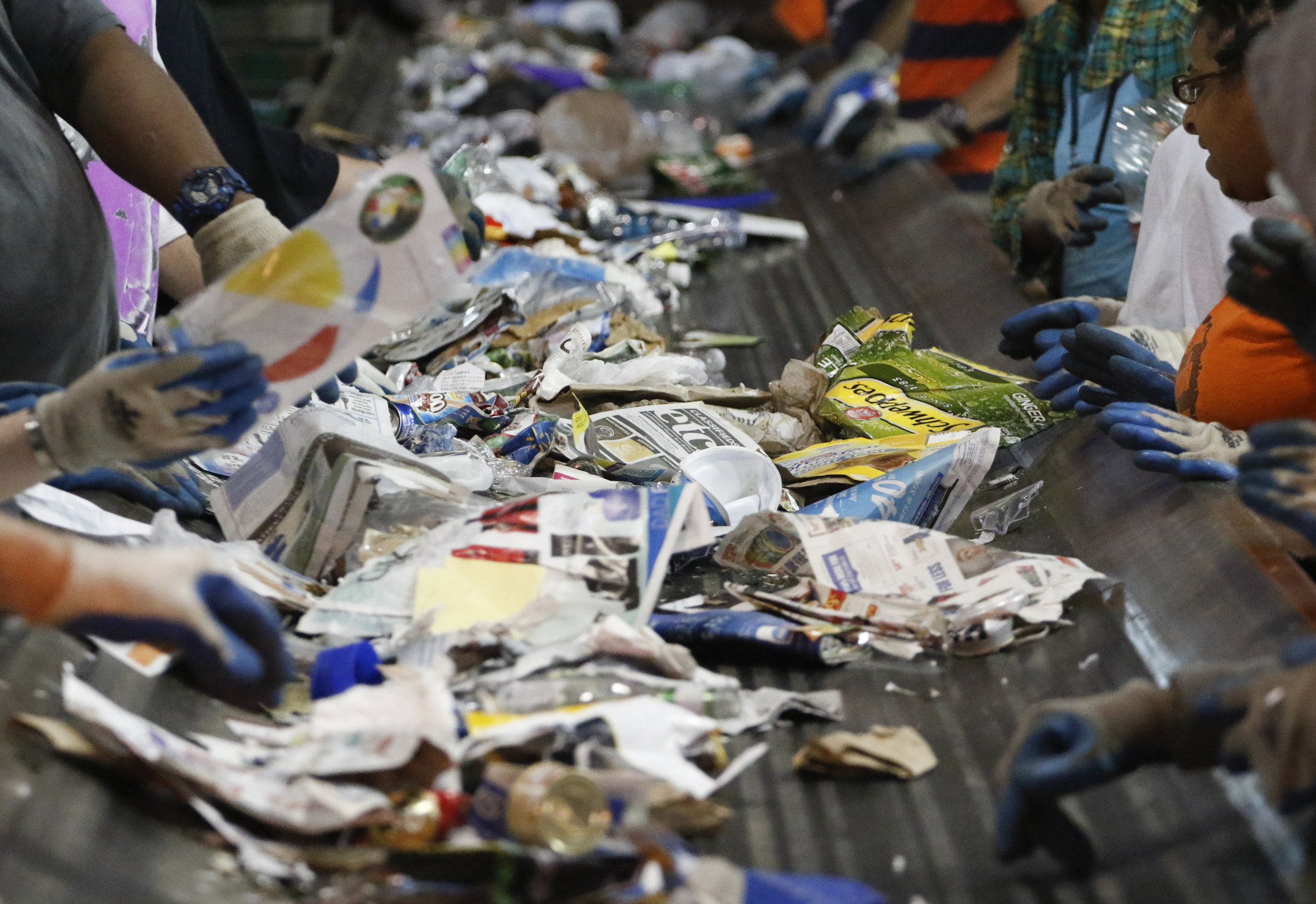 Staff Photo by Dan Henry / The Chattanooga Times Free Press- 7/6/16. Items to be recycled travel down a conveyor belt at the Orange Grove Material Recovery Facility on Wednesday, June 6, 2016.