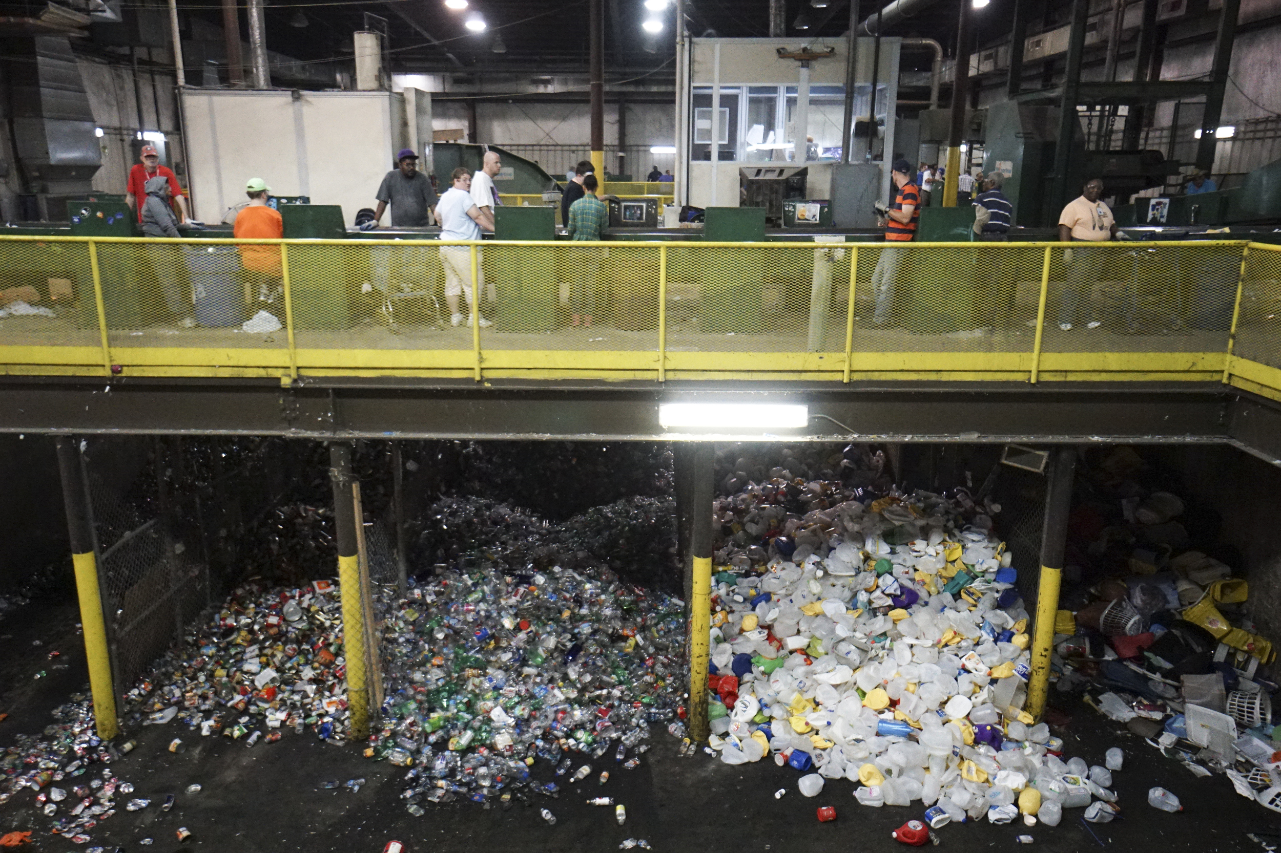 Staff Photo by Dan Henry / The Chattanooga Times Free Press- 7/6/16. Individuals with intellectual and or developmental disabilities sort items to be recycled at the Orange Grove Material Recovery Facility on Wednesday, June 6, 2016. Orange Grove officials are looking for new employment opportunities for their workers after a new law will force the facility to shut down.