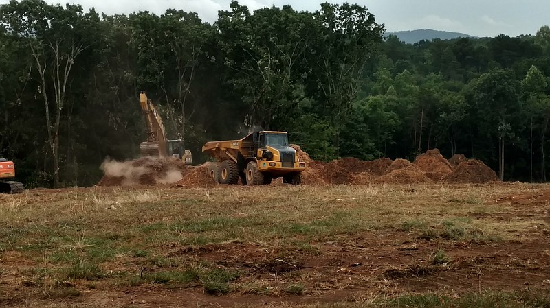 Staff photo by Mike Pare / Heavy equipment is clearing part of the site at planned new development off Highway 153 in Hixson. Hillocks Farm is to house 280 new apartments in first phase.