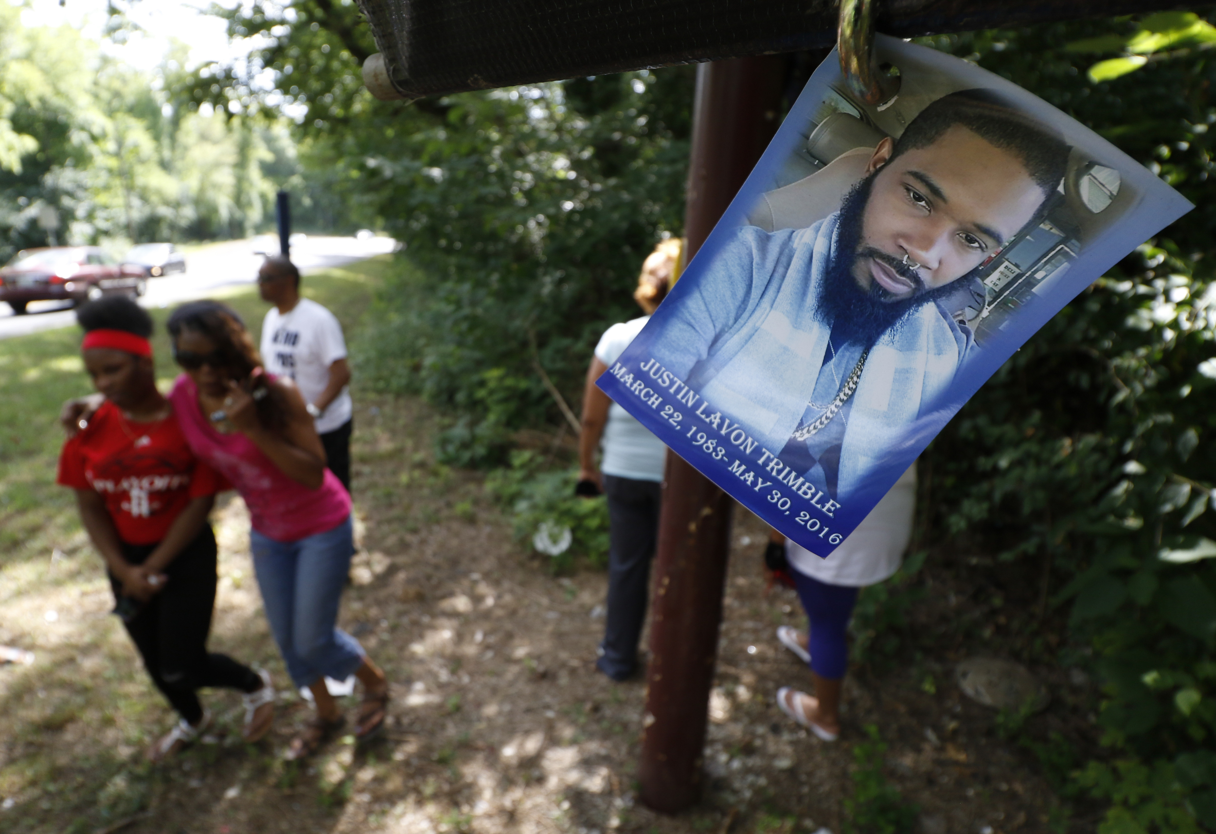 Staff Photo by Dan Henry / The Chattanooga Times Free Press- 7/7/16. Family members gather at the scene of the accident to mourn the loss of Justin LaVon Trimble who lost control of his motorcycle upon exiting the Wilcox Tunnel a month ago.