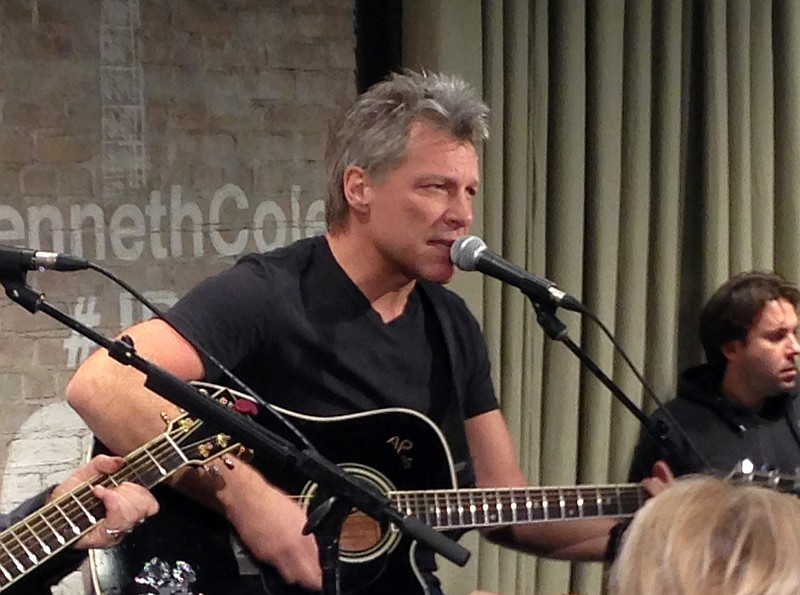 
              FILE - In this Feb. 12, 2015, file photo, Jon Bon Jovi performs in New York as part an acoustic music series, Common Thread, an initiative created by the award-winning singer-songwriter, and fashion designer Kenneth Cole. Videos posted online in July 2016 show Bon Jovi taking the microphone to sing his band's 1986 classic "Livin' on a Prayer." (AP Photo/John Carucci, File)
            