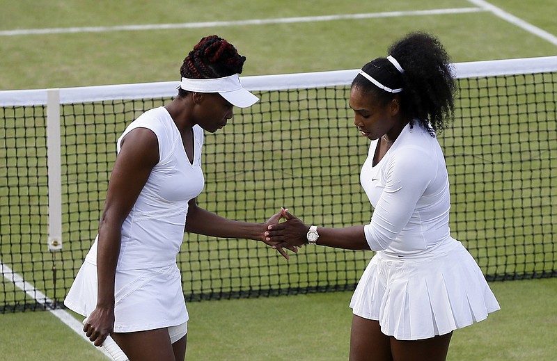 
              Venus Williams, left, and Serena Williams of the U.s celebrate a point against Lucie Hradecka and Andrea Hlavackova of the Czech Republic during their women's doubles match on day nine of the Wimbledon Tennis Championships in London, Tuesday, July 5, 2016. (AP Photo/Kirsty Wigglesworth)
            