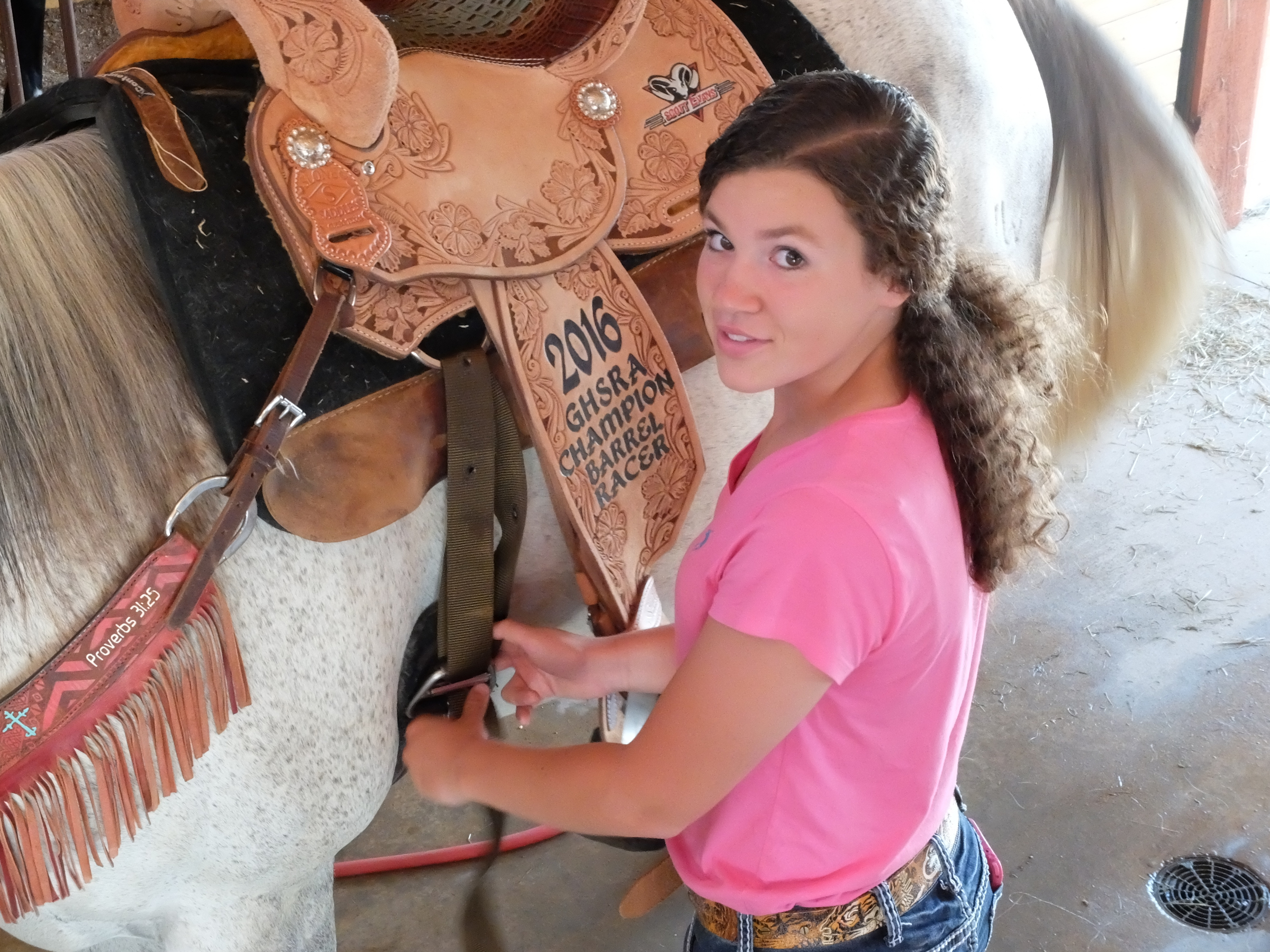 Holli Covey, 14, prepares her horse, Hank, for barrel racing competitions with twice-daily workouts. As a freshman at Notre Dame High School, Holli won the Georgia State High School Barrel Racing championship in May.