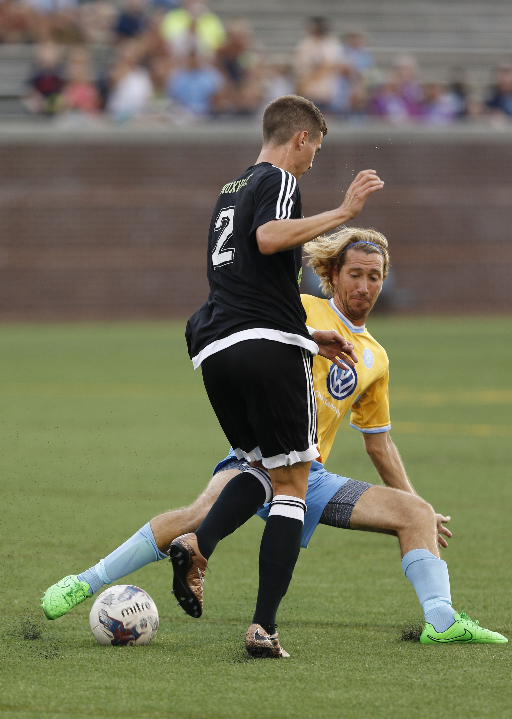 Staff Photo by Dan Henry / The Chattanooga Times Free Press- 7/8/16. Chattanooga Football Club's Juan Hernandez (19) and Knoxville's Raphael Beata (2) battle for possession of the ball during the first half of play at Finley Stadium on Friday, July 8, 2016.