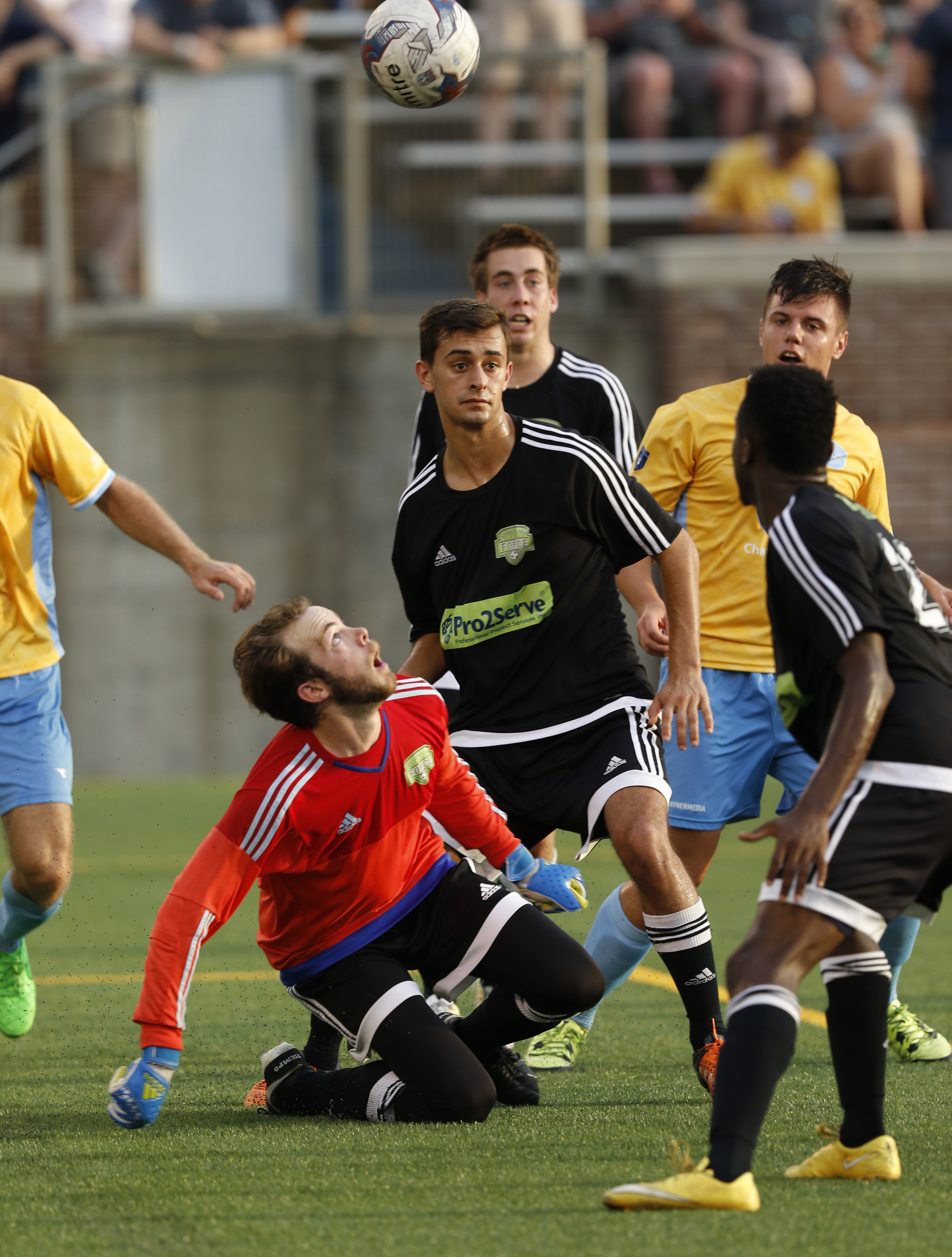 Staff Photo by Dan Henry / The Chattanooga Times Free Press- 7/8/16. Chattanooga Football Club forwards swarm as Knoxville keeper Martin Baker (0) keeps his eye on the ball during the first half of play at Finley Stadium on Friday, July 8, 2016.