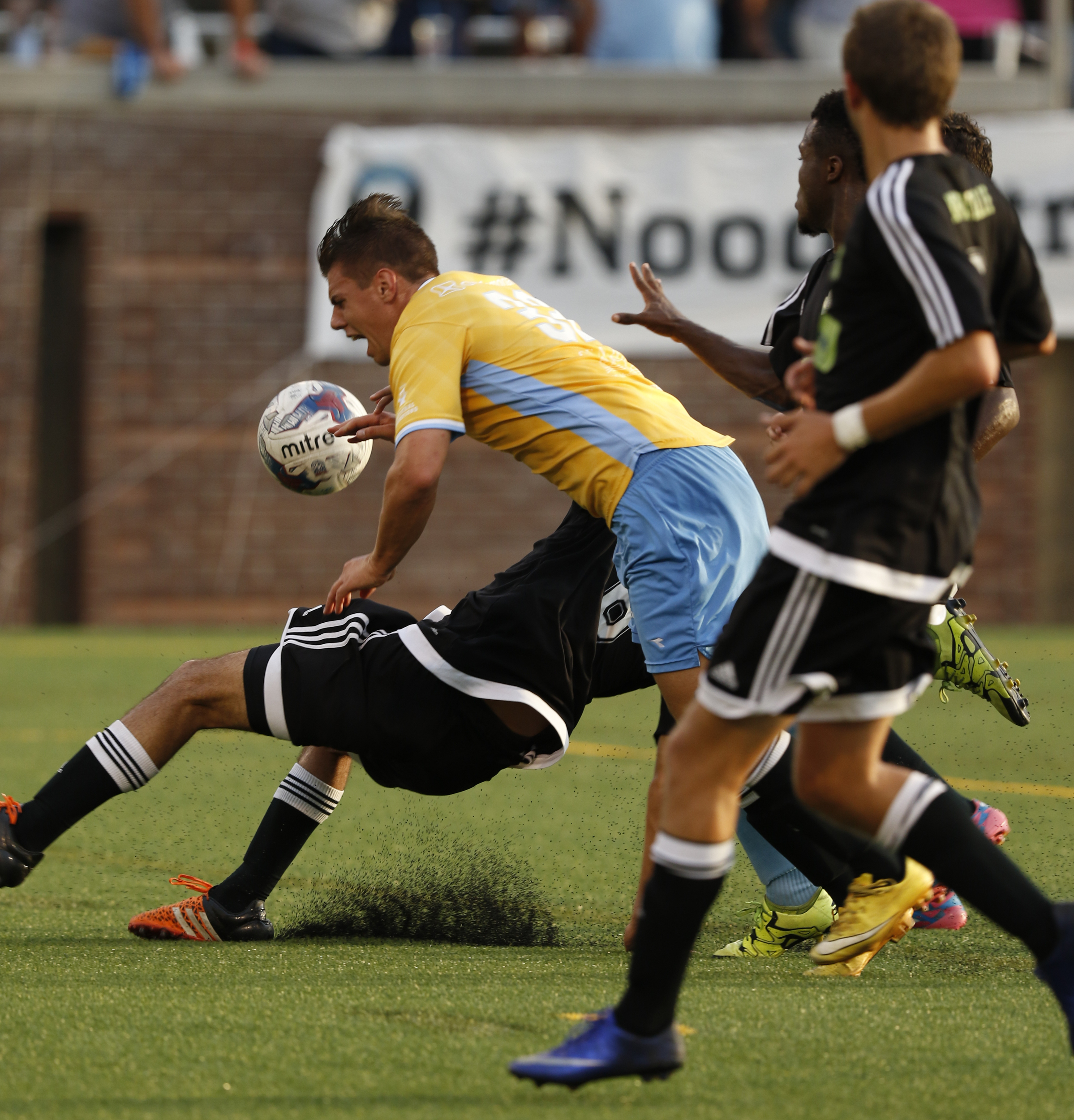 Staff Photo by Dan Henry / The Chattanooga Times Free Press- 7/8/16. Chattanooga Football Club's Will Roberts (32) is taken down before getting a direct free kick and scoring the first goal of the game against Knoxville during the first half of play at Finley Stadium on Friday, July 8, 2016.