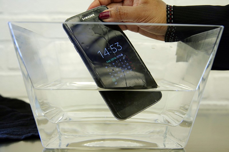 
              FILE - In this Feb. 22, 2016, file photo, a waterproof Samsung Galaxy S7 Edge mobile phone is submersed in water during a preview of Samsung's flagship store, Samsung 837, in New York's Meatpacking District. Consumer Reports says Samsung’s Galaxy S7 Active malfunctions in water despite being marketed as water resistant, though the regular S7 and S7 Edge models passed. Consumer Reports rates the S7 and S7 Edge phones as “Excellent” and the Active likely would have joined them. Instead, Consumer Reports isn’t recommending the model because two phones failed after being submerged in water. (AP Photo/Richard Drew, File)
            