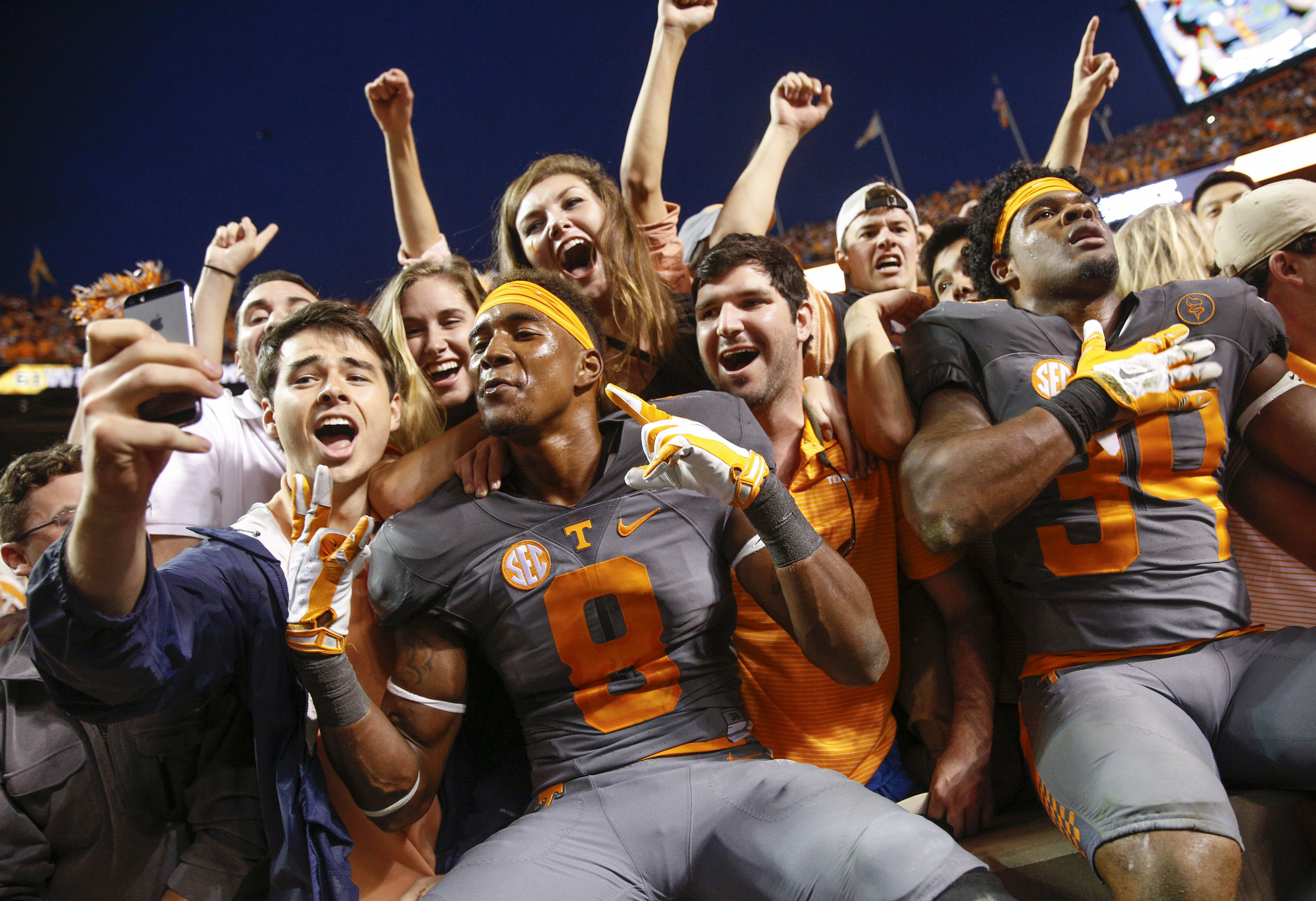 Tennessee wide receiver Marquez North (8) and defensive lineman Kendal Vickers (39) celebrate with the student section after their SEC conference football victory over Georgia at Neyland Stadium on Saturday, Oct. 10, 2015, in Knoxville, Tenn. Tennessee won 38-31.