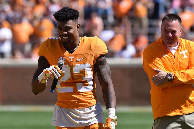Cameron Sutton (23) talks to the crowd about being named a captain while head coach Butch Jones looks on.  The University of Tennessee Orange/White Spring Football Game was held at Neyland Stadium in Knoxville on April 16, 2016.