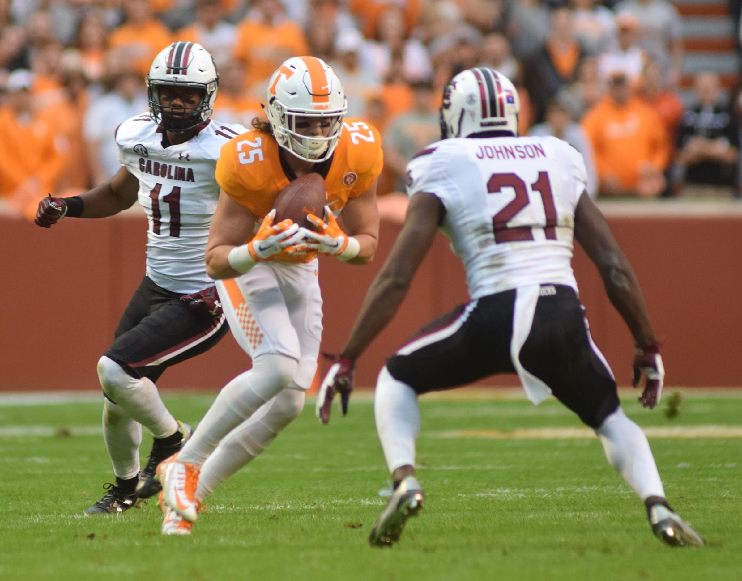 Tennessee's Josh Smith (25) makes a pass reception between two Gamecock defenders.  The South Carolina Gamecocks visited the Tennessee Volunteers in SEC football action November 7, 2015.