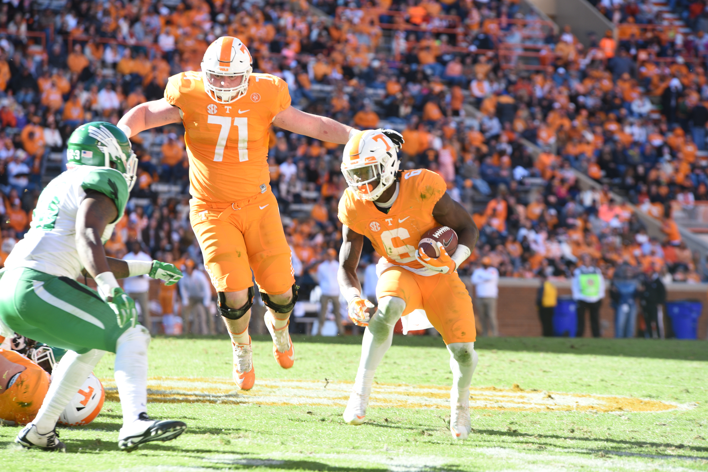 Tennessee outside linebacker Dylan Wiesman (71) gets some air as Alvin Kamara (6) looks for running room in second half action.
