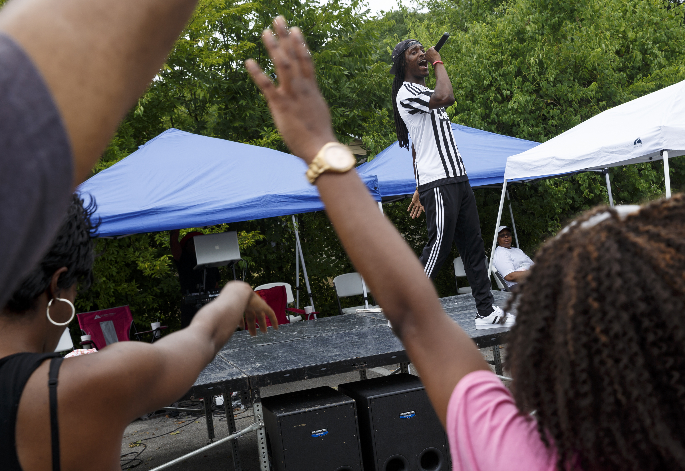 Rapper Tru Saint performs at a block party and fundraiser at Westside Baptist Church held to raise money for community projects to make Alton Park a better place to live on Saturday, July 9, 2016, in Chattanooga, Tenn. The fundraiser, organized by Westside Baptist Church and the Nation of Islam, was held to assist in the establishment of the Community Haven which will include a nutrition and healthy eating program, counseling, and other services.
