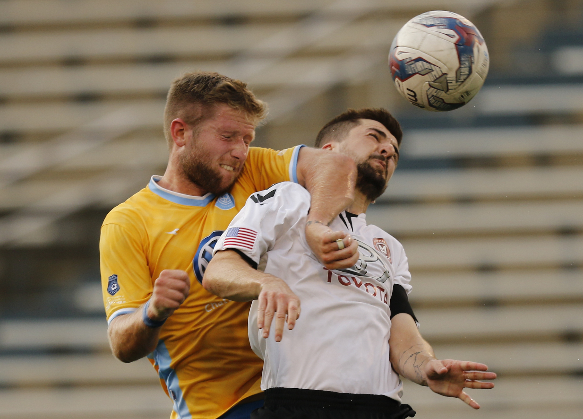CFC's Luke Winter heads the ball against Memphis's Neil Cummings during Chattanooga FC's playoff match against Memphis City at Finley Stadium on Saturday, July 9, 2016, in Chattanooga, Tenn.