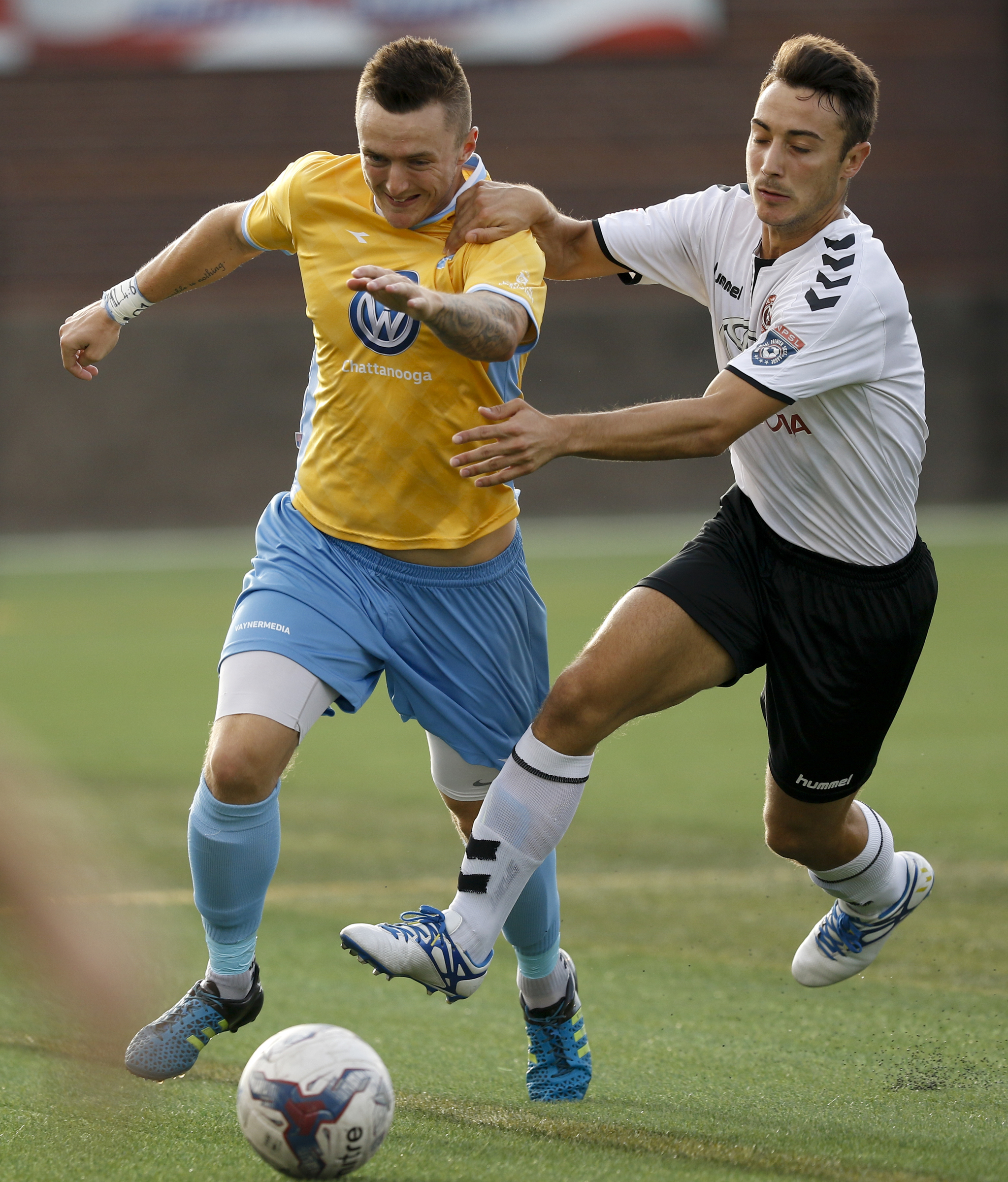 CFC's Jon Finlay, left, tries to get ahead of Memphis's Ivan Acimovic during Chattanooga FC's playoff match against Memphis City at Finley Stadium on Saturday, July 9, 2016, in Chattanooga, Tenn.