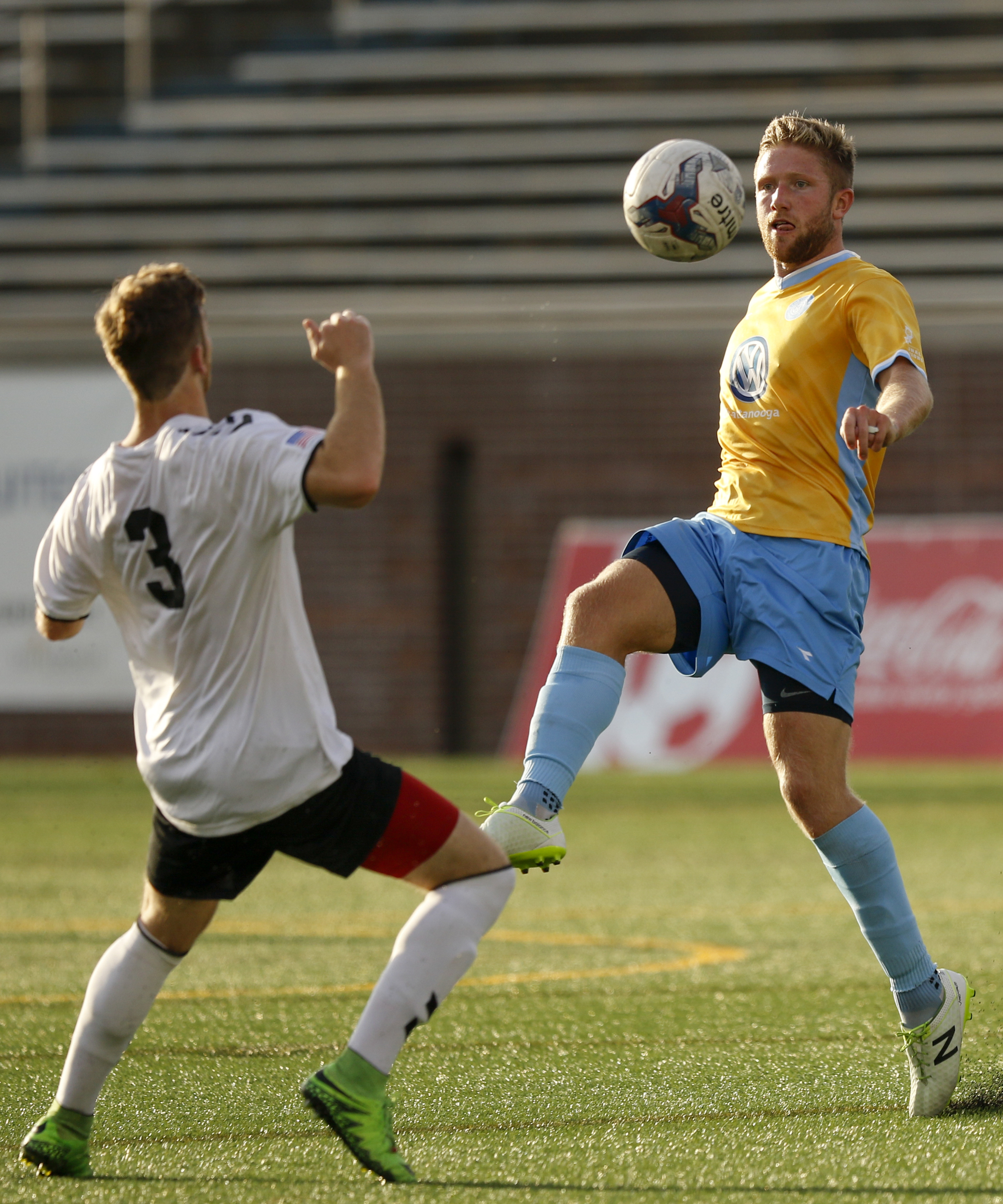 CFC's Luke Winter stops the ball ahead of Memphis's Barrett Mills (3) during Chattanooga FC's playoff match against Memphis City at Finley Stadium on Saturday, July 9, 2016, in Chattanooga, Tenn.