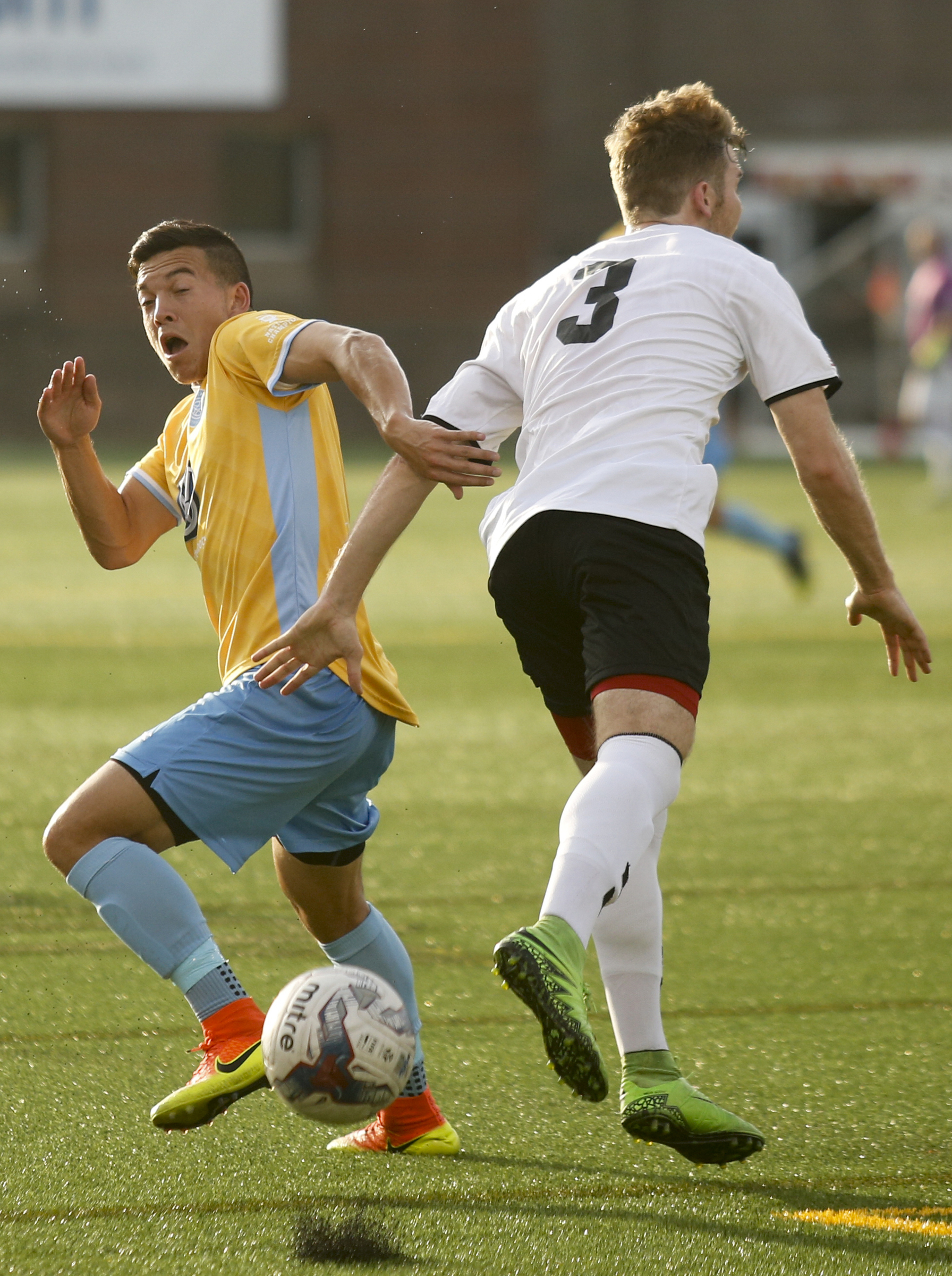 CFC's John Carrier, left, breaks around Memphis's Barrett Mills during Chattanooga FC's playoff match against Memphis City at Finley Stadium on Saturday, July 9, 2016, in Chattanooga, Tenn.