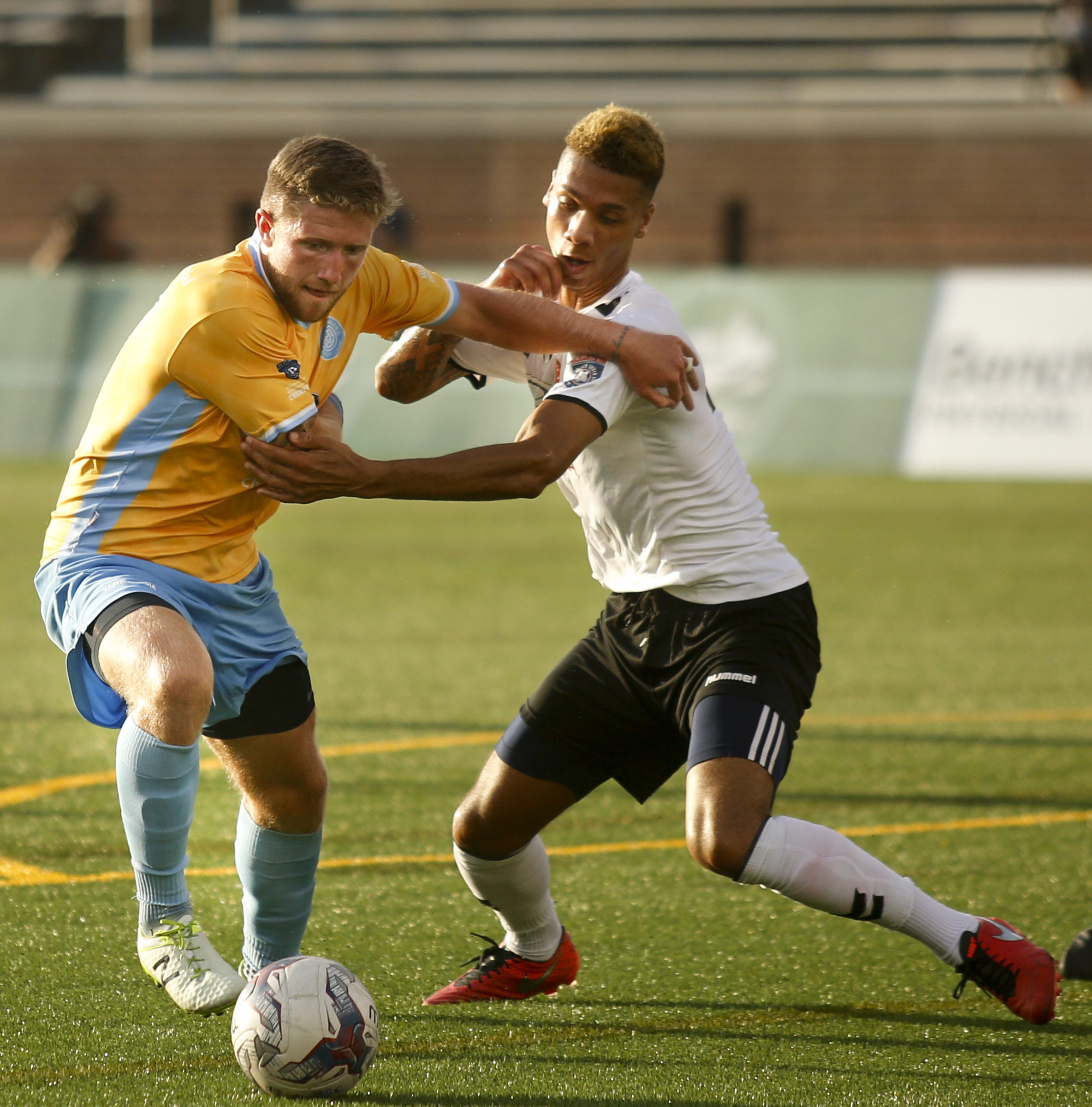 CFC's Luke Winter tries to find room around Memphis's Jerry Junior during Chattanooga FC's playoff match against Memphis City at Finley Stadium on Saturday, July 9, 2016, in Chattanooga, Tenn.