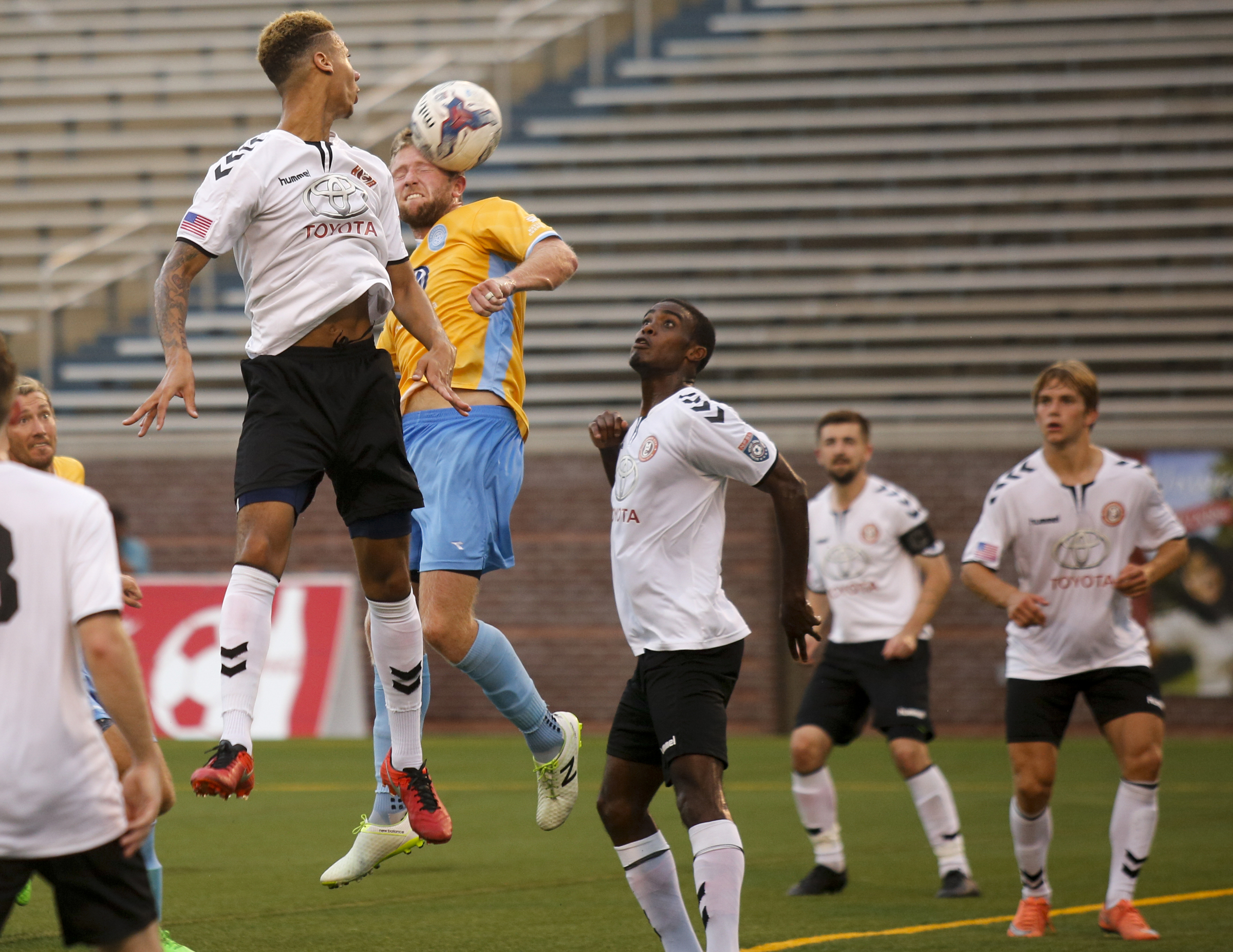 Memphis players watch as CFC's Luke Winter attempts a header on the goal during Chattanooga FC's playoff match against Memphis City at Finley Stadium on Saturday, July 9, 2016, in Chattanooga, Tenn.