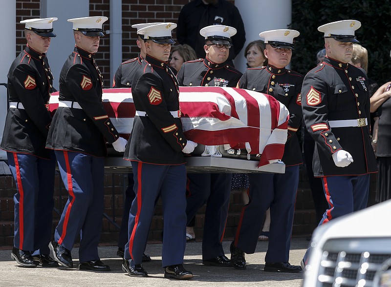 United States Marines carry the casket of U.S. Marine Corps Staff Sgt. David Wyatt out of Hixson United Methodist Church after his funeral service Friday, July 24, 2015, in Hixson, Tenn. Staff Sgt. Wyatt was killed in the July, 16 shootings at the Naval Operational Support Center and Marine Corps Reserve Center on Amnicola Highway which left five dead, including shooter Mohammad Youssef Abdulazeez, and a Chattanooga police officer wounded.