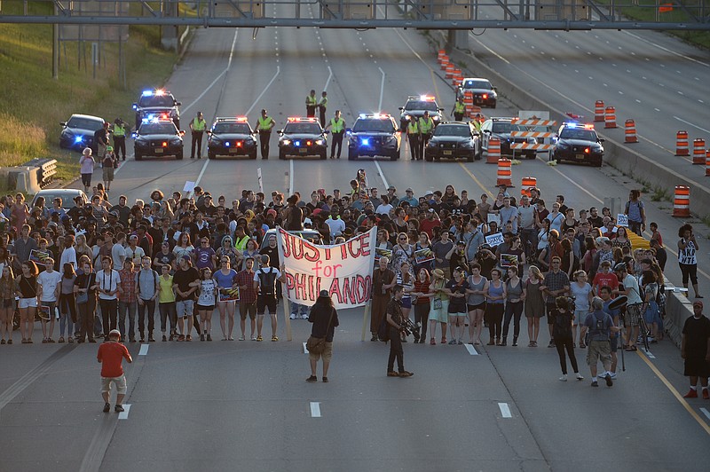 
              Marchers block part of Interstate 94 in St. Paul, Minn., Saturday, July 9, 2016, during a protest sparked by the recent police killings of black men in Minnesota and Louisiana. (Glen Stubbe/Star Tribune via AP)
            