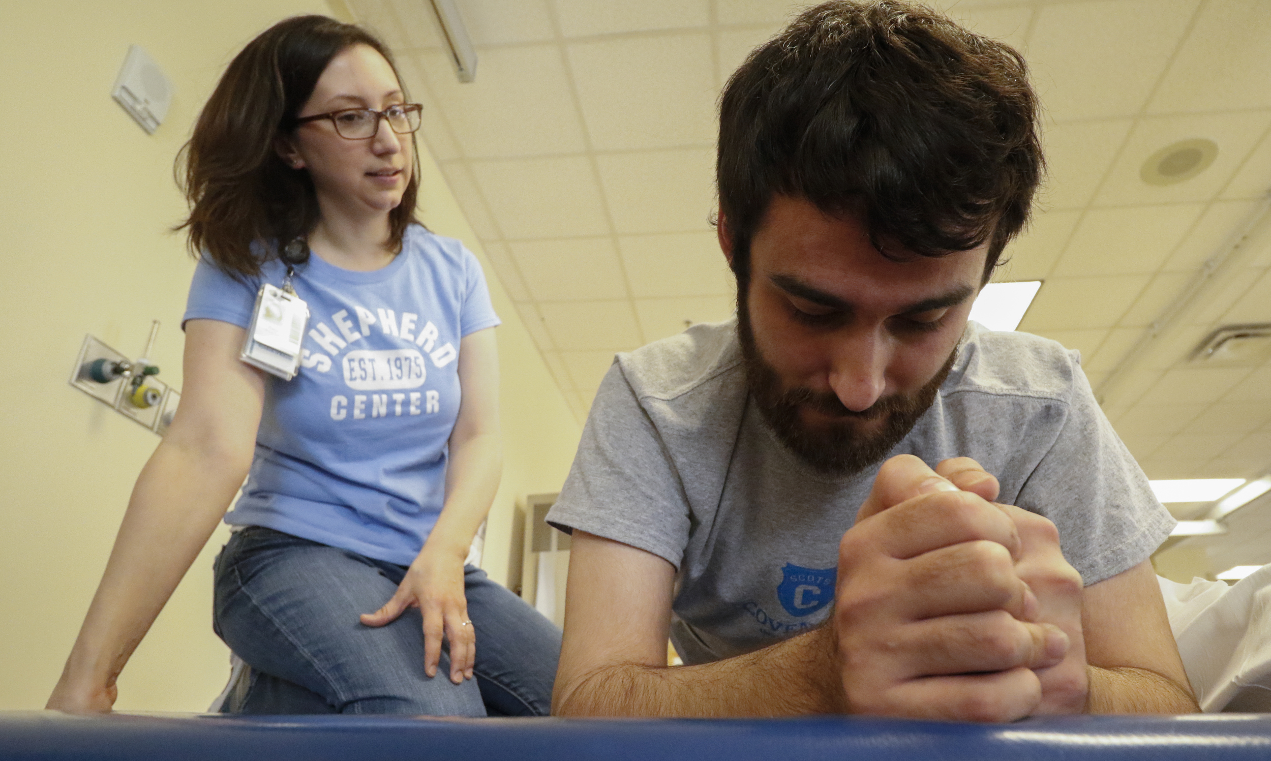 Staff Photo by Dan Henry / The Chattanooga Times Free Press- 6/27/16. Sara Brockman, an occupational therapist at the Shepherd Center, works with Joel Elmore to help him regain core strength while at the rehabilitation center in Atlanta, Ga., on Monday, June 27, 2016. Elmore, a 22-year-old, contracted Guillain-Barre Syndrome in his senior year of college and was totally immobilized but is now going through physical rehab at Shepherd.