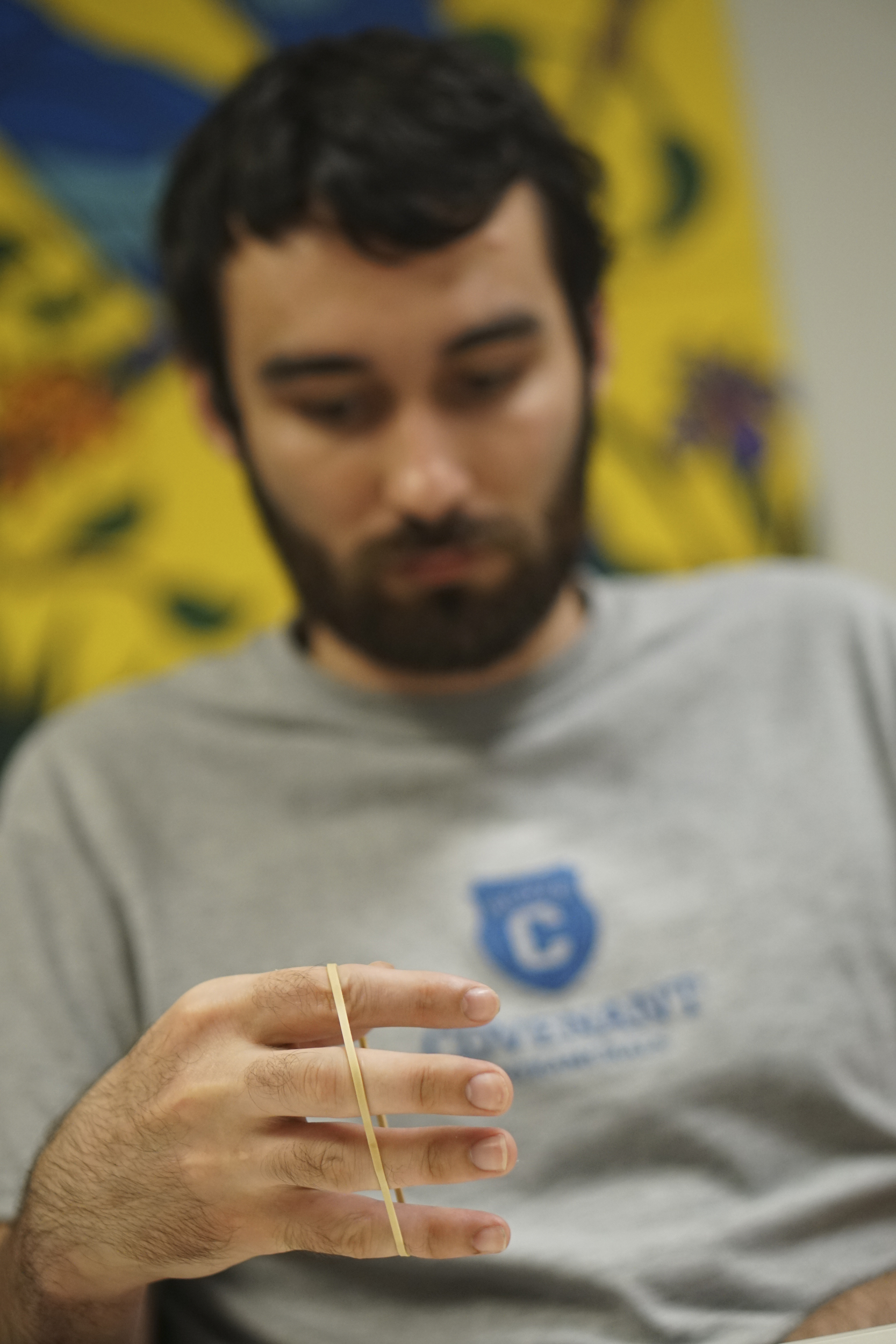 Staff Photo by Dan Henry / The Chattanooga Times Free Press- 6/27/16. Joel Elmore works on regaining hand dexterity while at Shepherd Center in Atlanta, Ga., on Monday, June 27, 2016. Elmore, a 22-year-old, contracted Guillain-Barre Syndrome in his senior year of college and was totally immobilized but is now going through physical rehab at Shepherd.