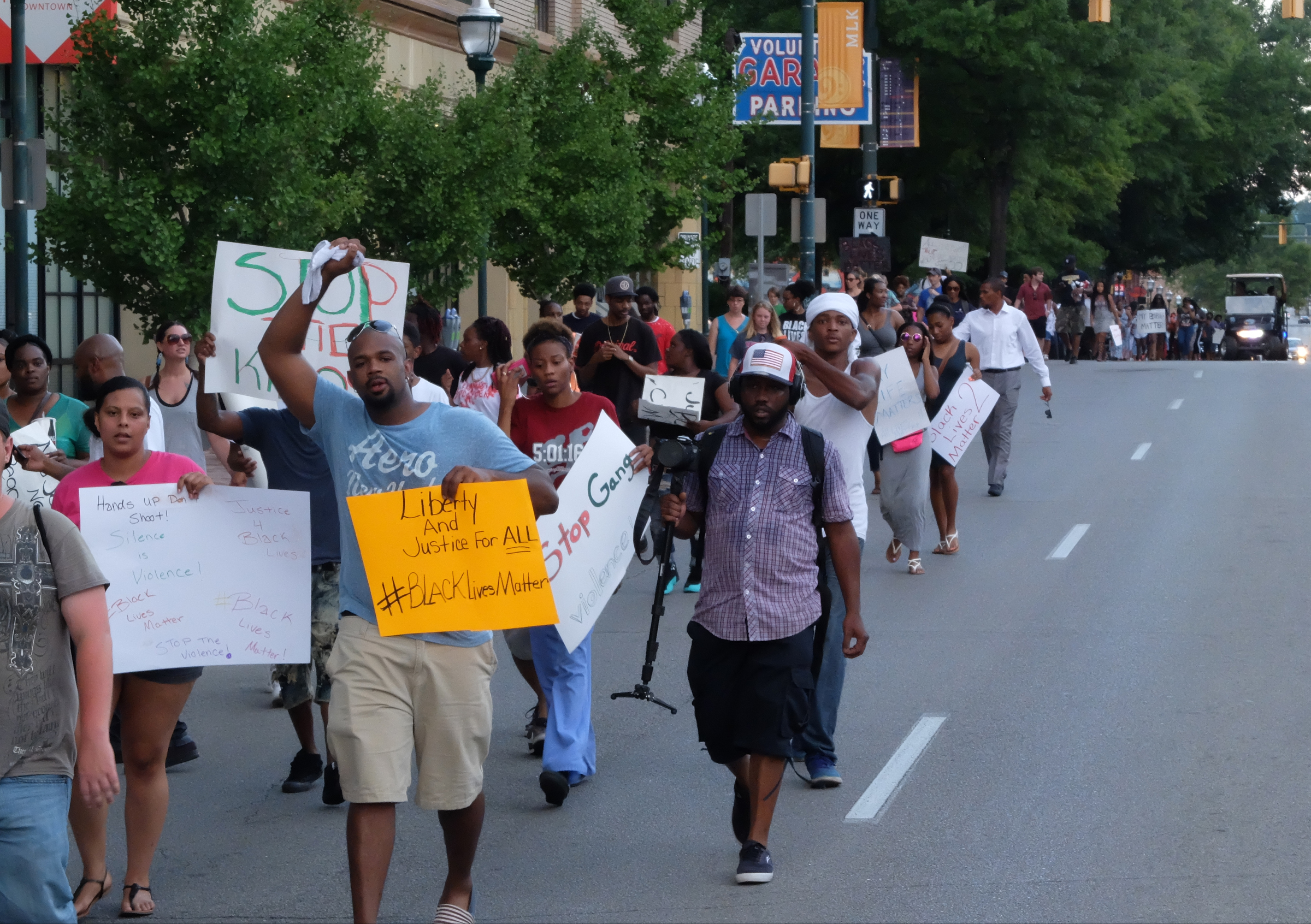 A march to end violence proceeds on M.L. King Blvd. late Sunday in downtown Chattanooga. The march began and ended at Coolidge Park on the Northshore of the southeast Tennessee city. Participants walked for more than two hours beginning at 6 p.m., making the loop across the Tennessee River to downtown and back across ending at 8:25 p.m.
