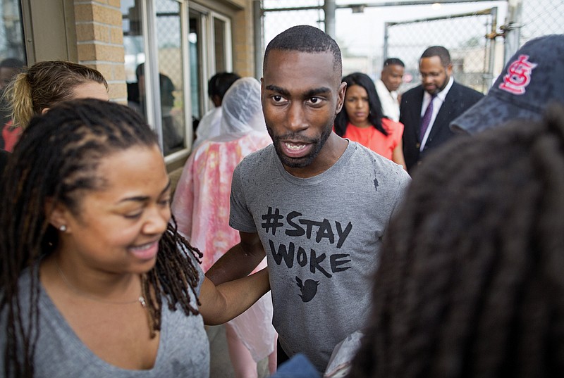 
              Black Lives Matter activist DeRay Mckesson walks out of the Baton Rouge jail in Baton Rouge, La. on Sunday, July 10, 2016. The prominent Black Lives Matter activist, three journalists and more than 120 other people have been taken into custody in Louisiana over the past two days, authorities said Sunday, after protests over the fatal shooting of an African-American man by two white police officers in Baton Rouge. (AP Photo/Max Becherer)
            