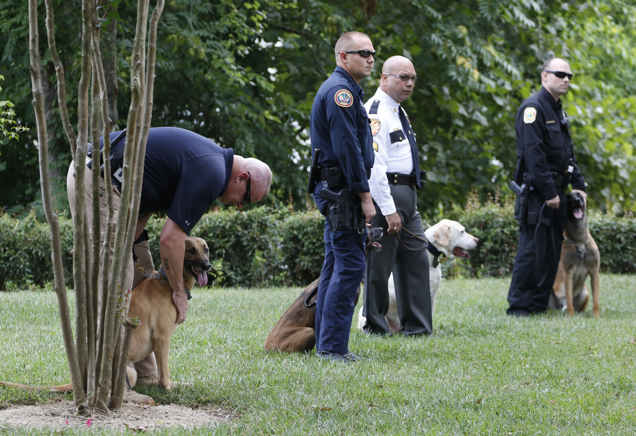 Staff Photo by Dan Henry / The Chattanooga Times Free Press- 7/11/16. Law enforcement officers listen as Tom Edd Wilson, president of the AEGIS Law Enforcement Foundation, speaks during a press conference at the Tennessee Riverpark announcing that twelve new bullet proof vests have been purchased by the Miller Family Foundation for local area K9 law enforcement officers.