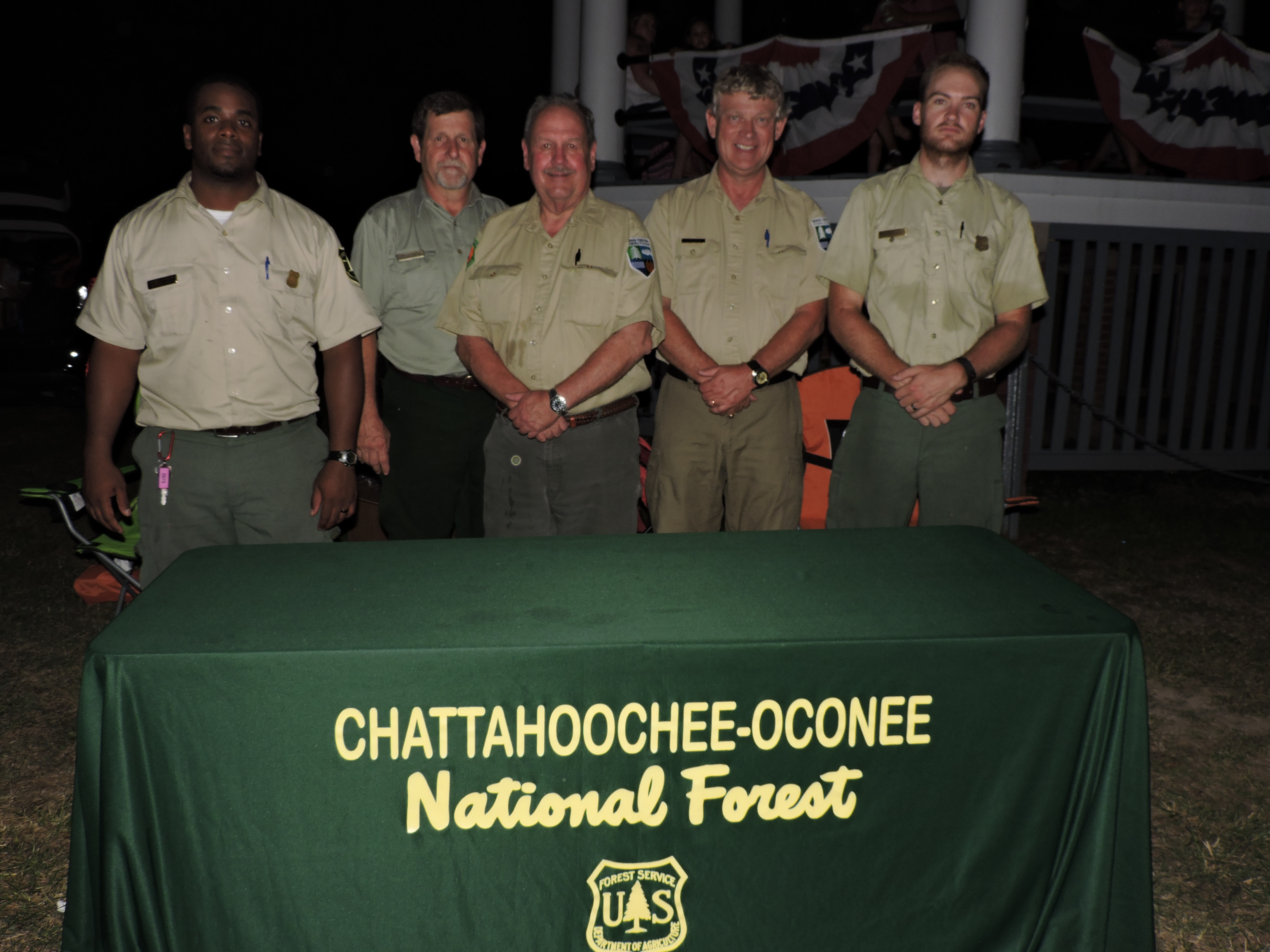 Conasauga Wildfire Fire Prevention Team/Chattahoochee Oconee National Forest representatives talk about fire prevention. From left are U.S. Forestry Services/ Fire Management Specialist DeQuincy Gordon, firefighter David Kuykendall, Georgia Forestry Commission Wildlife Prevention Specialist Beryl Budd, U.S. Forest Service Conasauga Ranger John Stephens, and Fire Prevention Team Leader Mark Wiles.