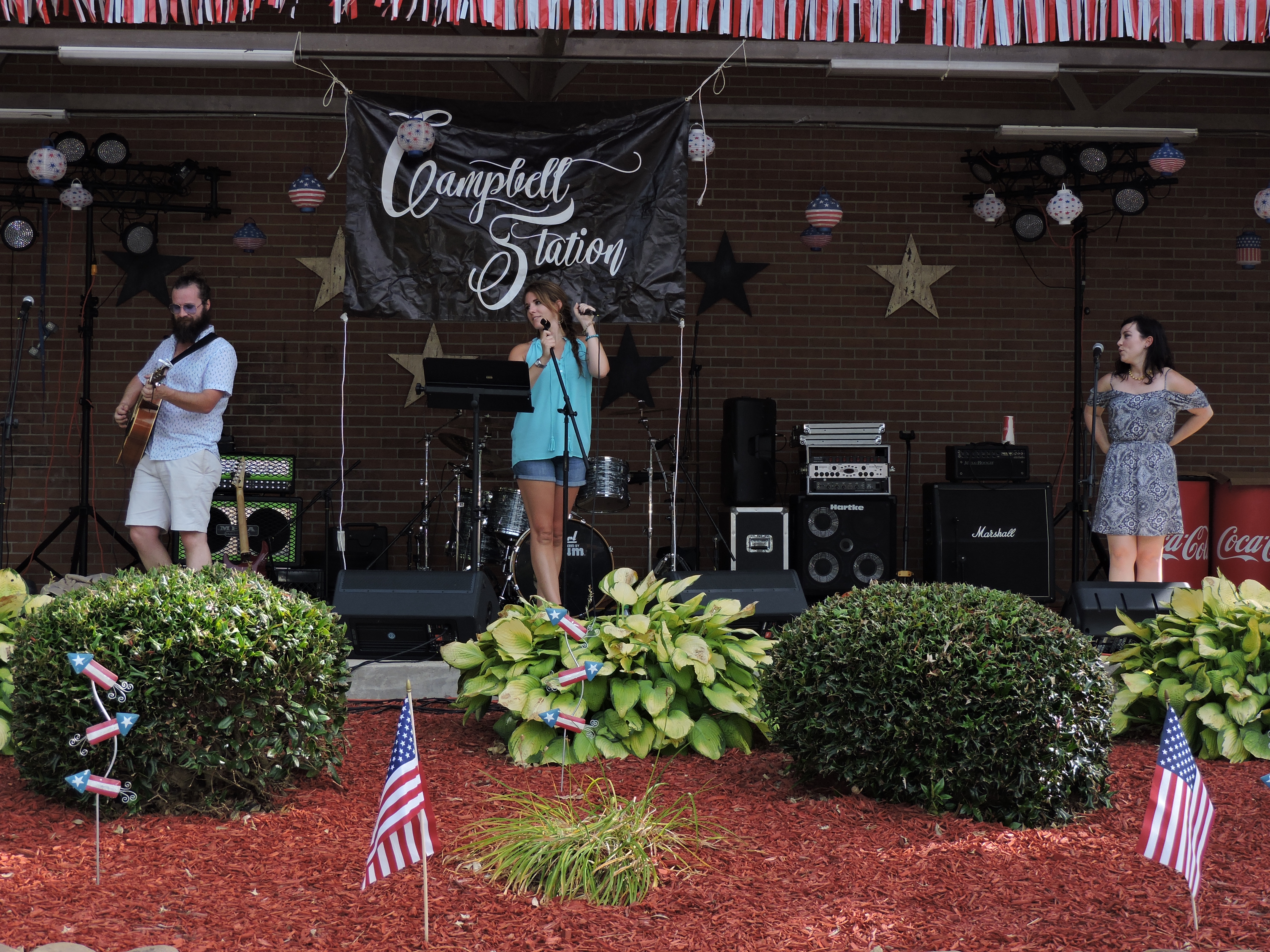 Campbell Station prepares to perform one of many of their songs. From left are lead guitarist Seth Ferguson and duo lead singers Campbell Ross and Elaina Campbell Conner. Also performing at the festival were Laney Marks, The Spanky's and the 8TRK Band.