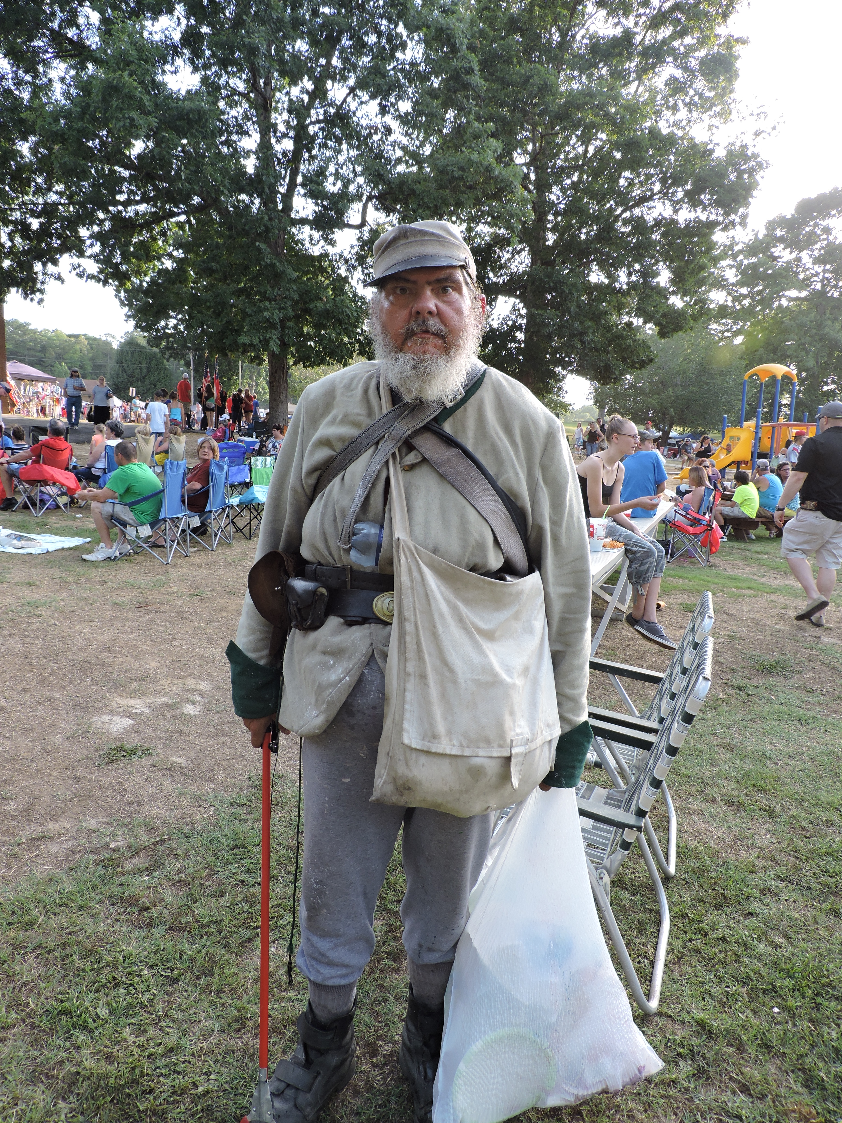 Kevin Anthony Smith, of LaFayette, picks up litter at the city's Freedom Festival. He is known for walking around town in his Civil War style uniform, that of the 8th Alabama Confederate Cavalry. He tells people who speak to him about the Battle of LaFayette that occurred June 24, 1864.