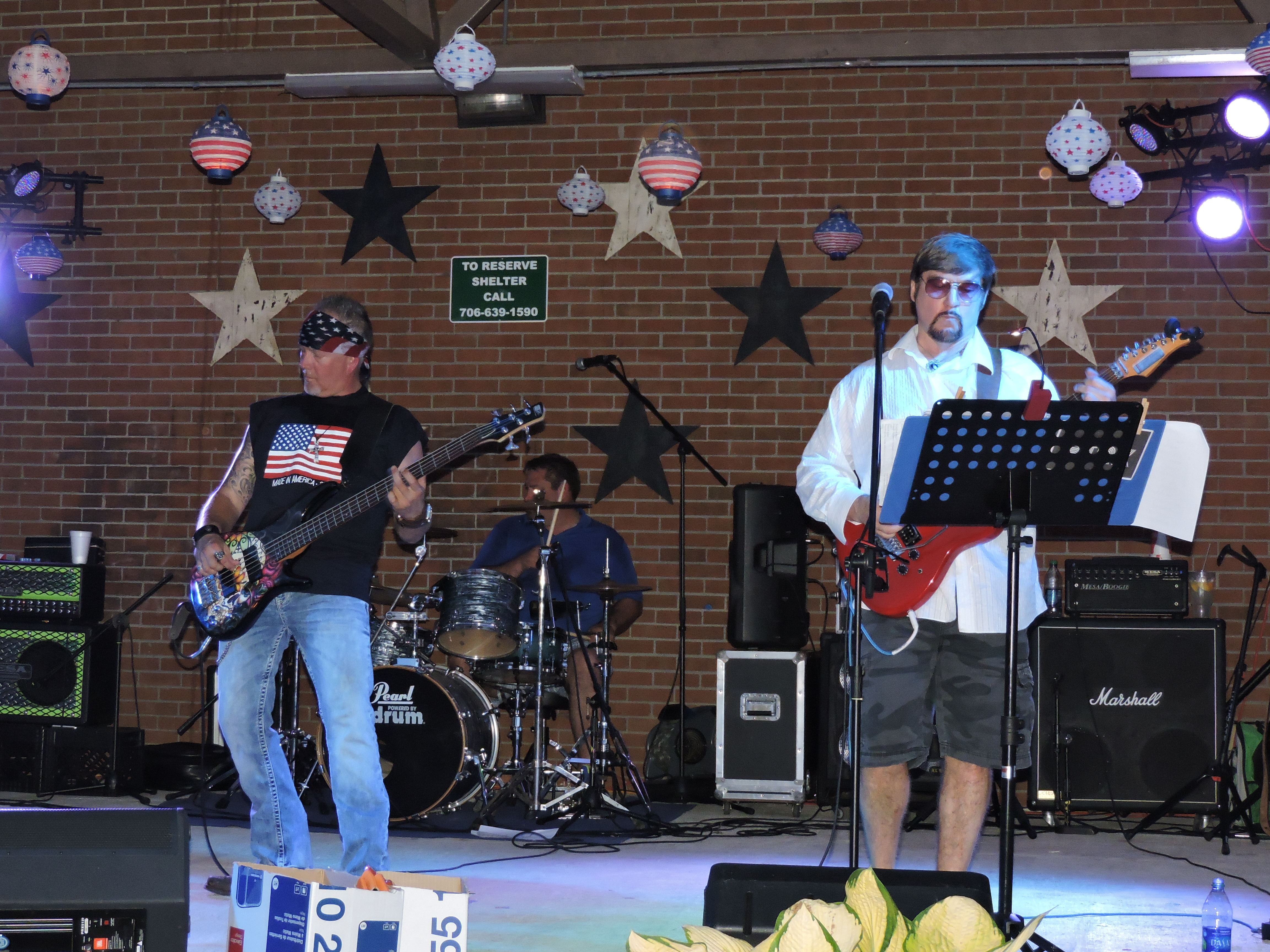 Jim Denham, left, a guitarist with 8trk Band, and singer/guitarist K.C. Campbell, of LaFayette, rock the stage at the LaFayette Freedom Festival. Also performing at the festival were Laney Marks, The Spanky's and Campbell Station.