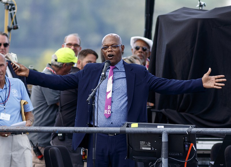 Samuel L. Jackson asks spectators to please donate during the Chattanooga Unite Tribute Concert at Ross's Landing on Wednesday, Sept. 16, 2015, in Chattanooga, Tenn. Jackson, a Chattanooga native, emceed the benefit concert for families of victims of the July, 16, shootings at military facilities in Chattanooga.