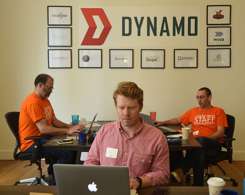 Jake Bolling, center, Joshua Pines, left, and Benjamin Rubin work Monday, July 11, 2016, at Dynamo, a logistics and transportation accelerator launched by Access America founders.