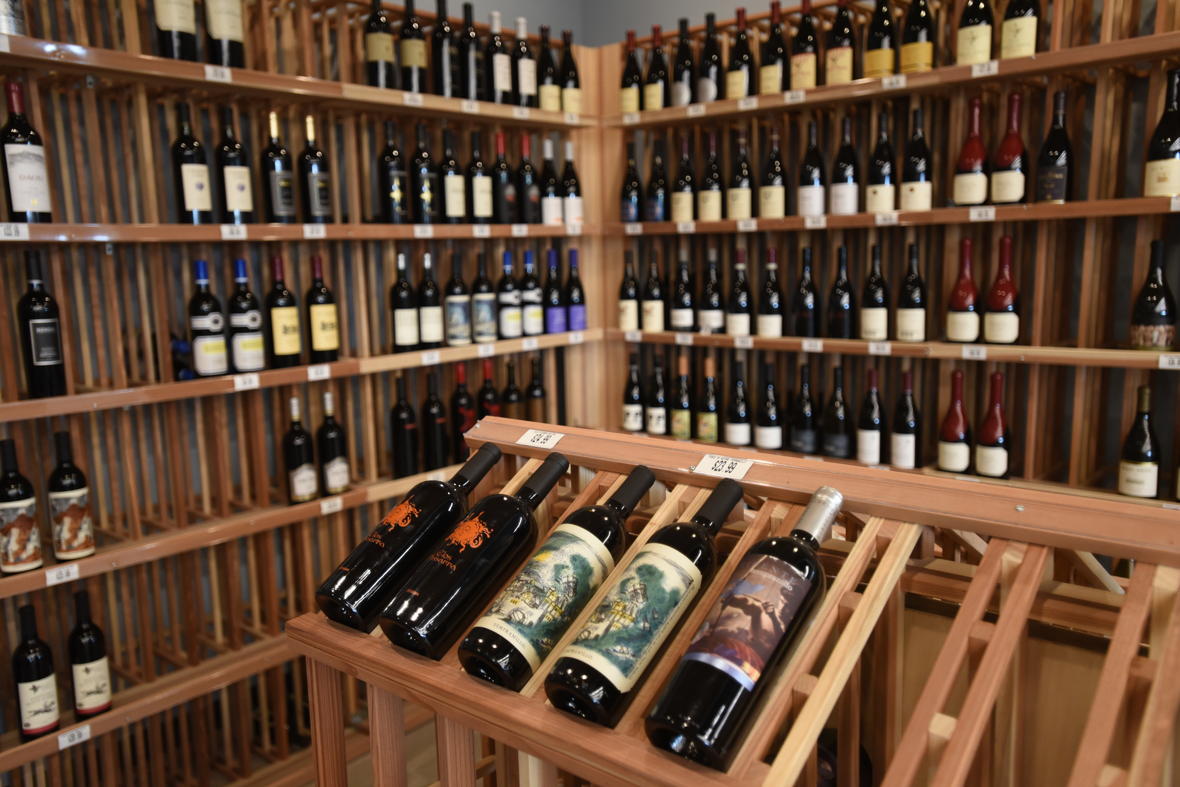 WIn fills the shelves Tuesday, July 12, 2016, at Chattanooga Wine and Spirits.