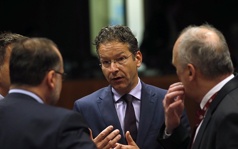 
              Dutch Finance Minister and chair of the eurogroup finance ministers Jeroen Dijsselbloem, center, speaks with other ministers at the start of the Economic and Financial Affairs Council meeting at the EU Council building in Brussels, Belgium, Tuesday, July 12, 2016. (AP Photo/Darko Vojinovic)
            