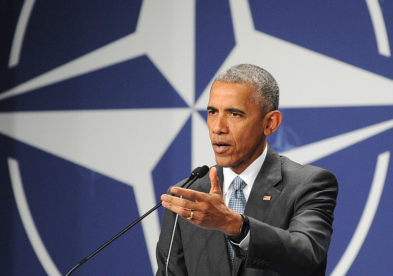 United States President Barack Obama gestures during a press conference ending the second day of the NATO Summit, in Warsaw, Poland, Saturday, July 9, 2016. (AP Photo/Alik Keplicz)
            
