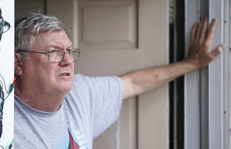 Staff Photo by Dan Henry / The Chattanooga Times Free Press- 6/30/16. John C. Simpson, father of John Shannon Simpson, speaks about his son while in the doorway of John C.'s Anderson, S.C., residence.  former brother in law of Jeff Simpson, and Simpson's 18-year-old nephew Blake Stutler, speak about Simpson's youth. John Simpson the founder of Marines & Mickey is under federal investigation for stolen valor and is accused of misappropriating funds by the leaders of the Lance Corporal Skip Wells Foundation. 