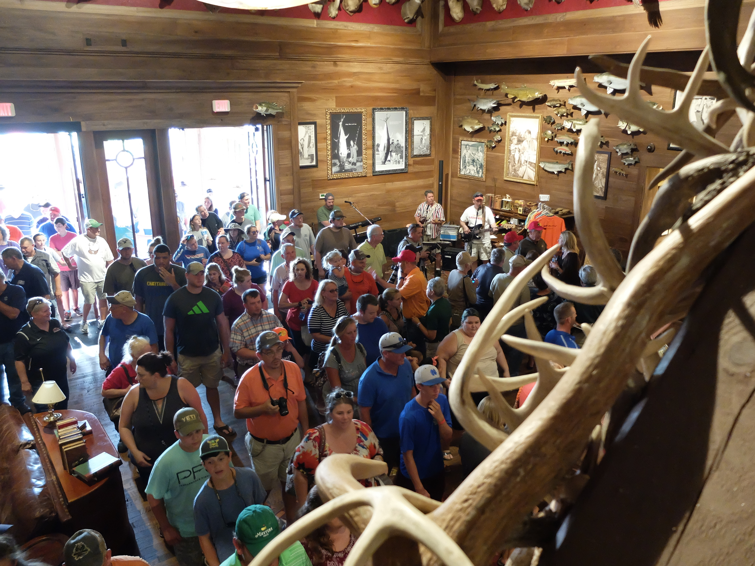 People fill the lobby as the doors swing open to the 85,000-square-foot Bass Pro Shops Outpost in East Ridge late Wednesday.