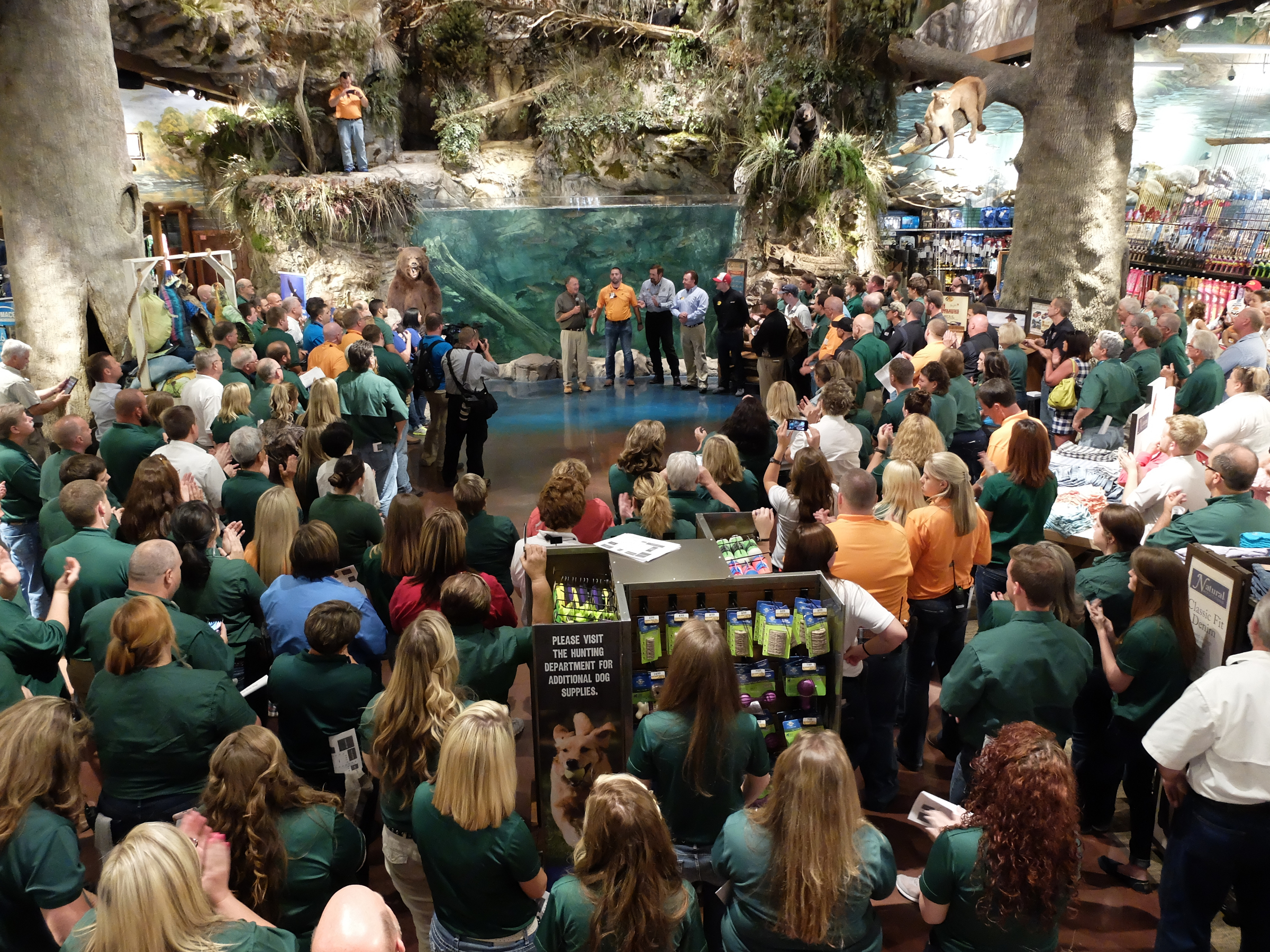 Dozens of employees gather to listen to Bass Pro Shops founder Johnny Morris on Wednesday inside the new East Ridge store.