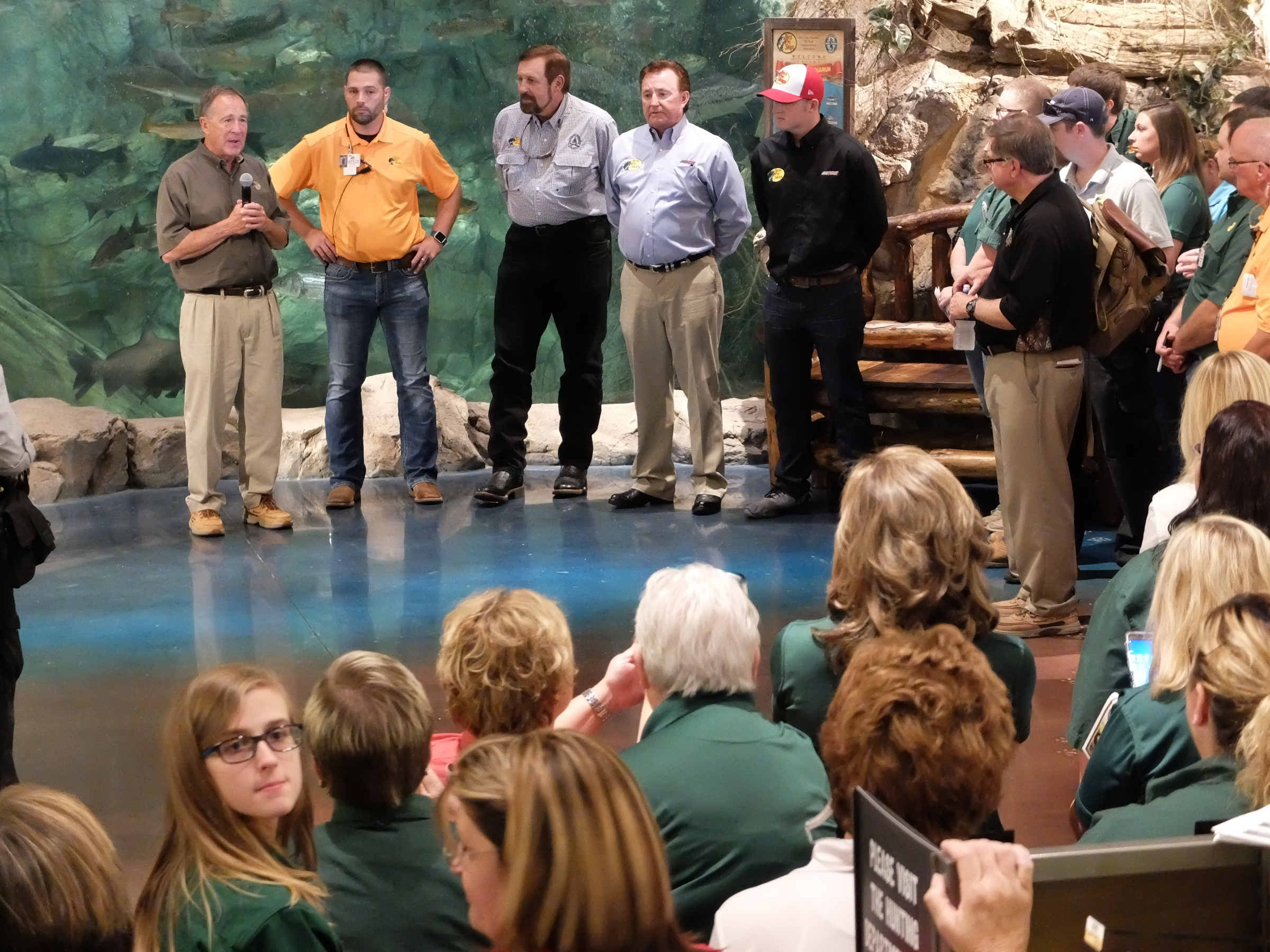 Johnny Morris, left, Bass Pro Shops founder, talks to employees before the opening in East Ridge late Wednesday. From left are, Morris, store manager Jarron Richie, Rob Keck, Richard Childress and Ty Dillon.