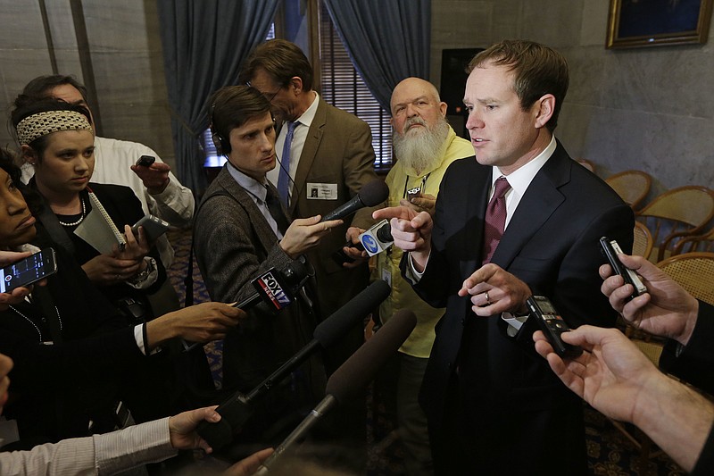 
              FILE - In this Tuesday, Jan. 12, 2016 file photo, Rep. Jeremy Durham, R-Franklin, right, speaks with reporters following a House Republican caucus meeting on the opening day of the second session of the 109th General Assembly in Nashville, Tenn. A special committee of the House of Representatives released a report Wednesday, July 13, in which an investigation of Durham has found he took advantage of his position to sexually harass at least 22 women. (AP Photo/Mark Humphrey, File)
            
