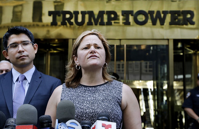 
              FILE - In this June 6, 2016 file photo, New York City Council Speaker Melissa Mark-Viverito, with City Councilman Carlos Menchaca, left, speaks at a news conference outside Trump Tower in New York.  Donald Trump’s lightning-rod proposals to deport illegal immigrants and temporarily ban Muslims from entering the United States could cost New York state more than $800 million and New York City more 340,000 jobs, according to an analysis by Mark-Viverito.  She is expected to unveil the findings in a speech Wednesday, July 13, 2016.    (AP Photo/Mark Lennihan, file)
            