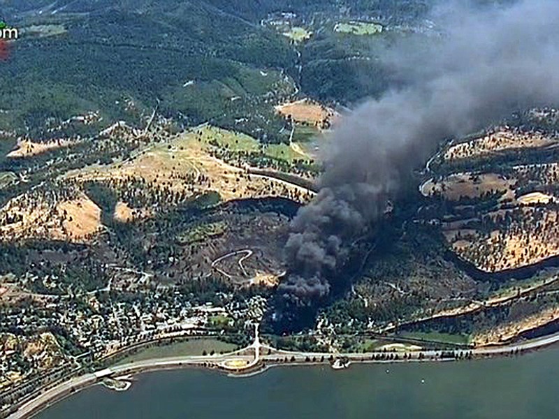 
              FILE--In thisJune 3, 2016, file frame from video provided by KGW-TV, smoke billows from a Union Pacific train that derailed near Mosier, Ore., in the scenic Columbia River Gorge. Railroads hauling crude oil would be required to develop comprehensive plans for dealing with a significant oil spill, including providing detailed information to state and tribal authorities, under a rule proposed Wednesday, July 13, by the Department of Transportation.(KGW-TV via AP, file) MANDATORY CREDIT
            